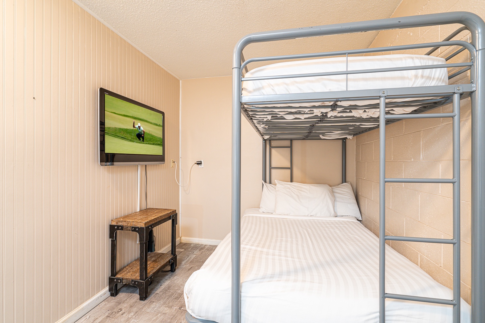 The game room sleeping area offers two twin-over-full bunkbeds & a Smart TV