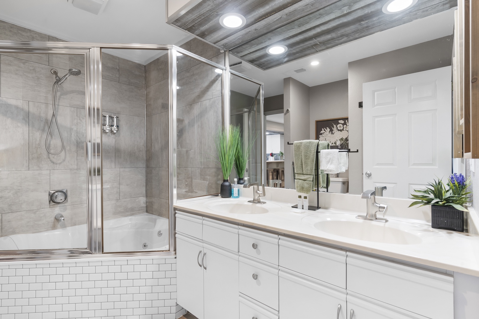 The final ensuite showcases a double vanity & shower/soaking tub combo