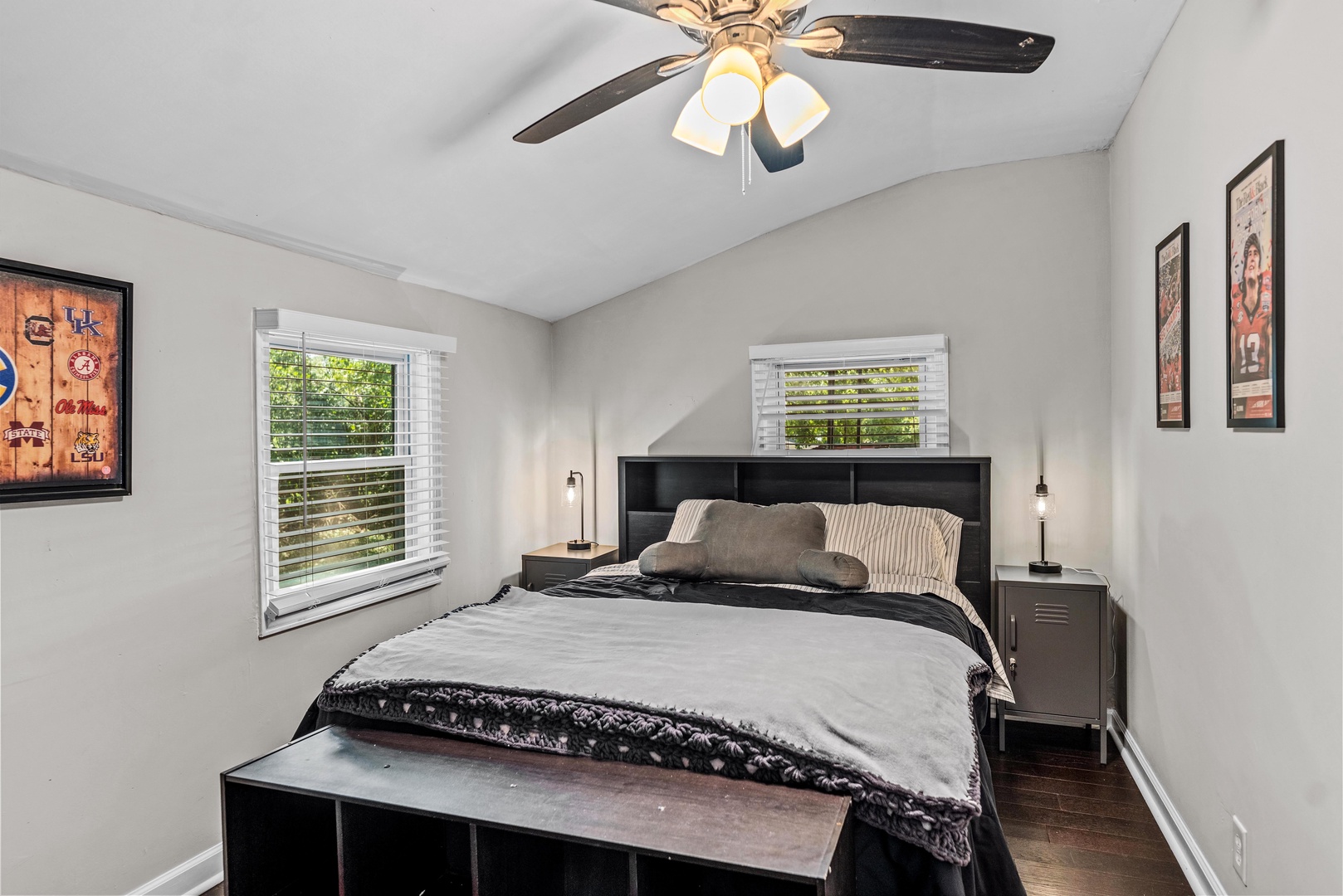 The main bedroom offers a queen-sized bed & ceiling fan