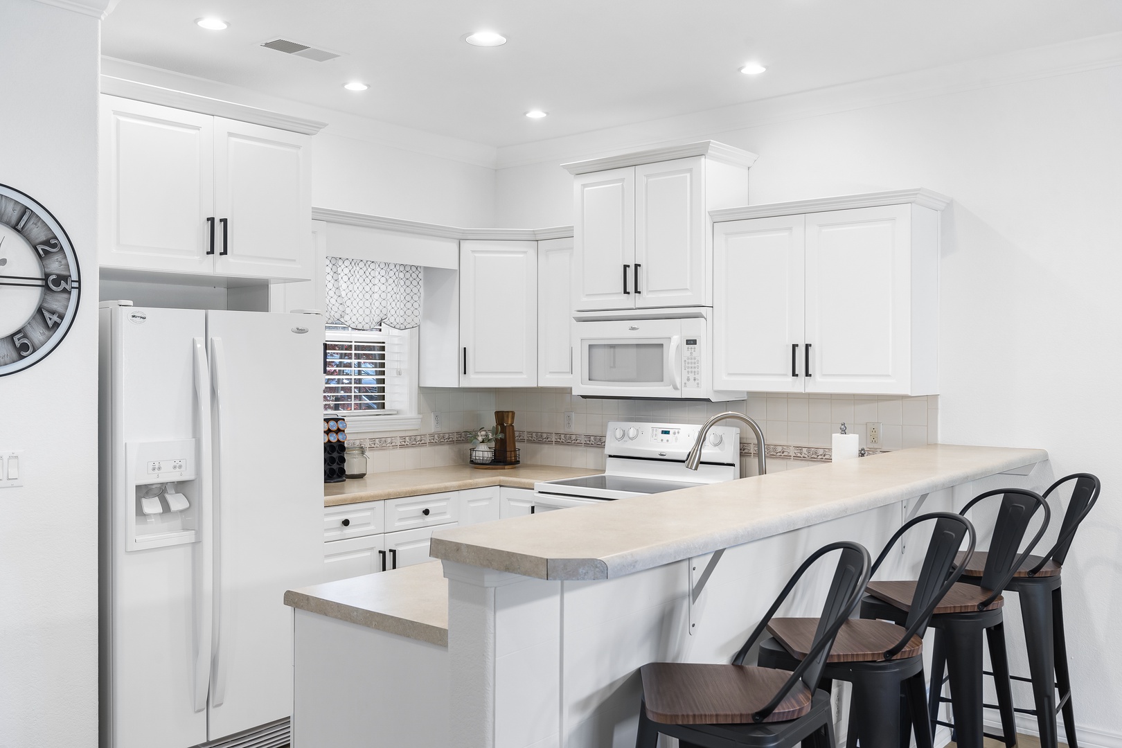 The fully equipped kitchen offers ample counter and storage spaceJ07422