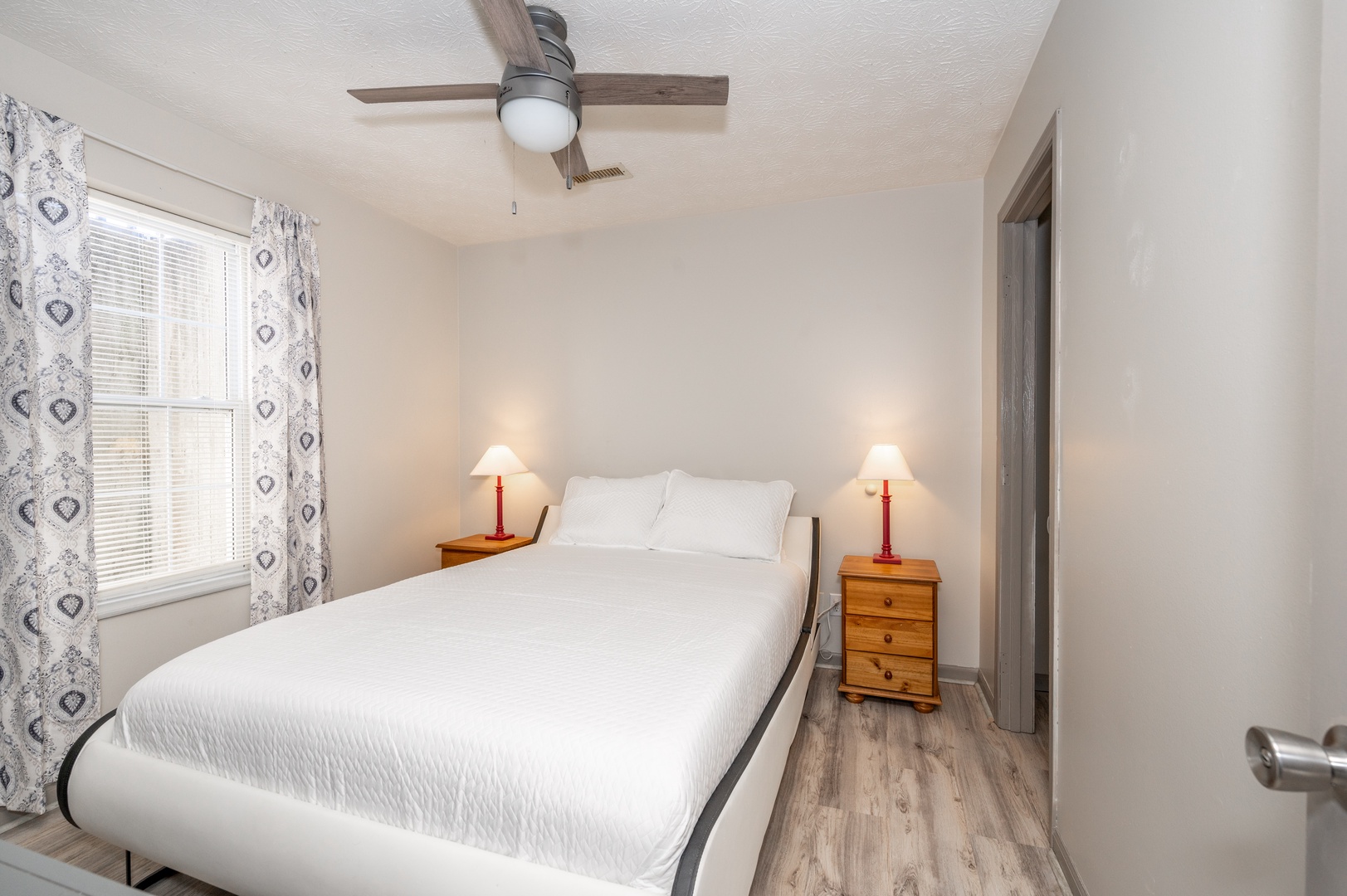 The second bedroom retreat offers a queen-sized bed & Smart TV