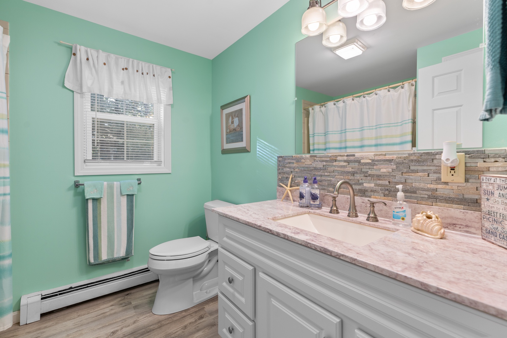 This 1st floor full bathroom offers a single vanity & shower/tub combo