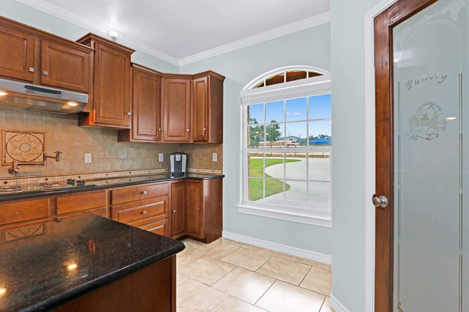 The warm, inviting kitchen offers ample space & all the comforts of home