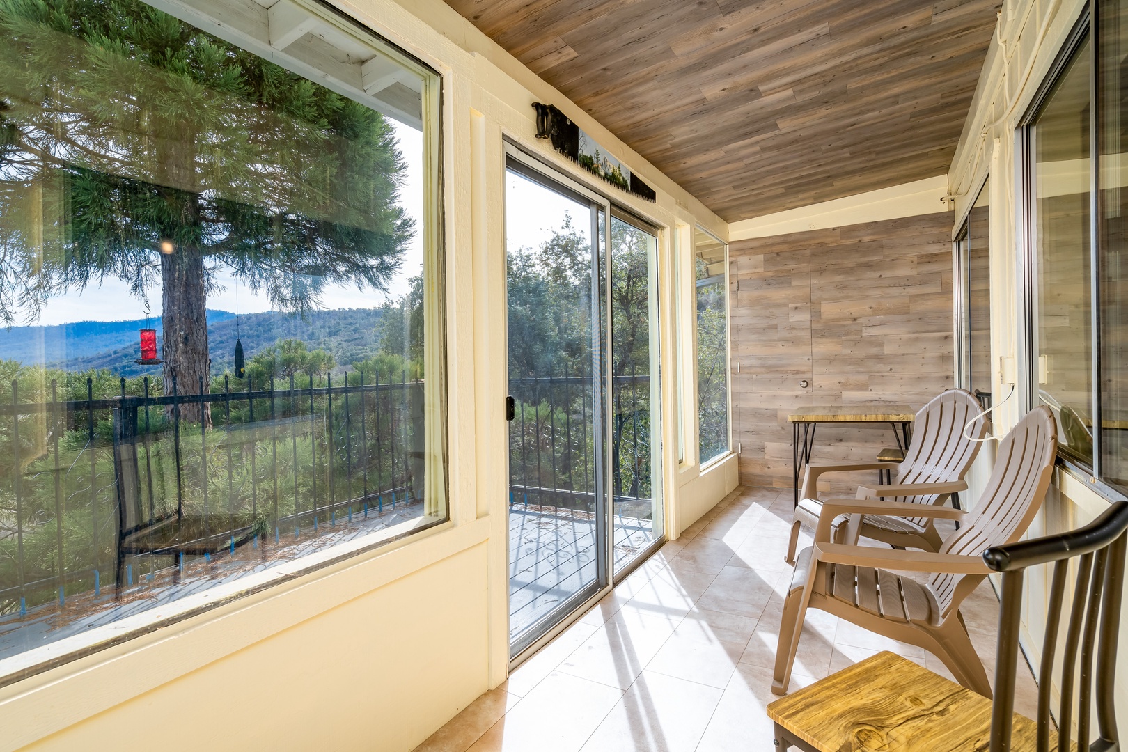Unwind in the sunroom, basking in the beauty of breathtaking natural views