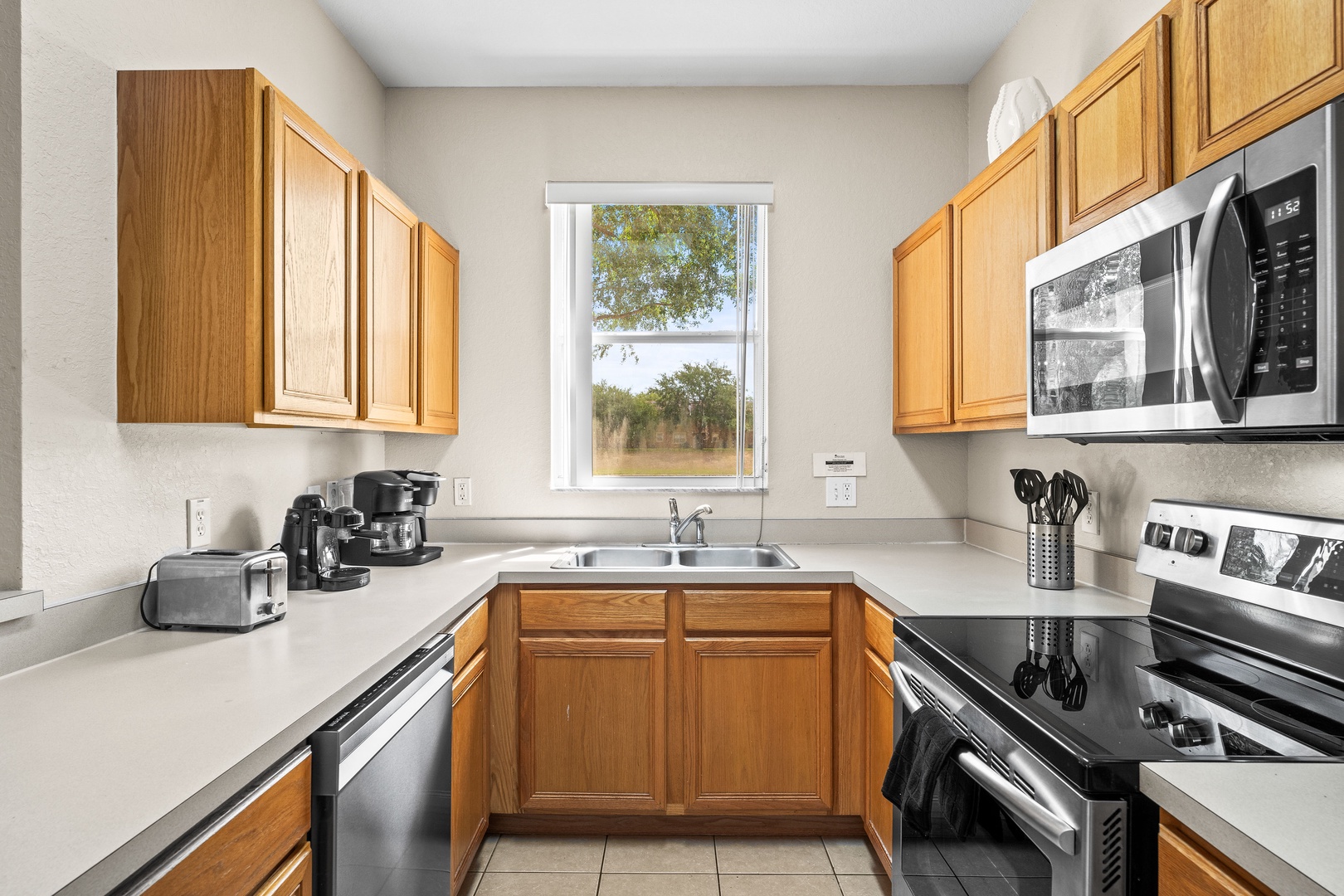The kitchen offers ample storage space & all the comforts of home