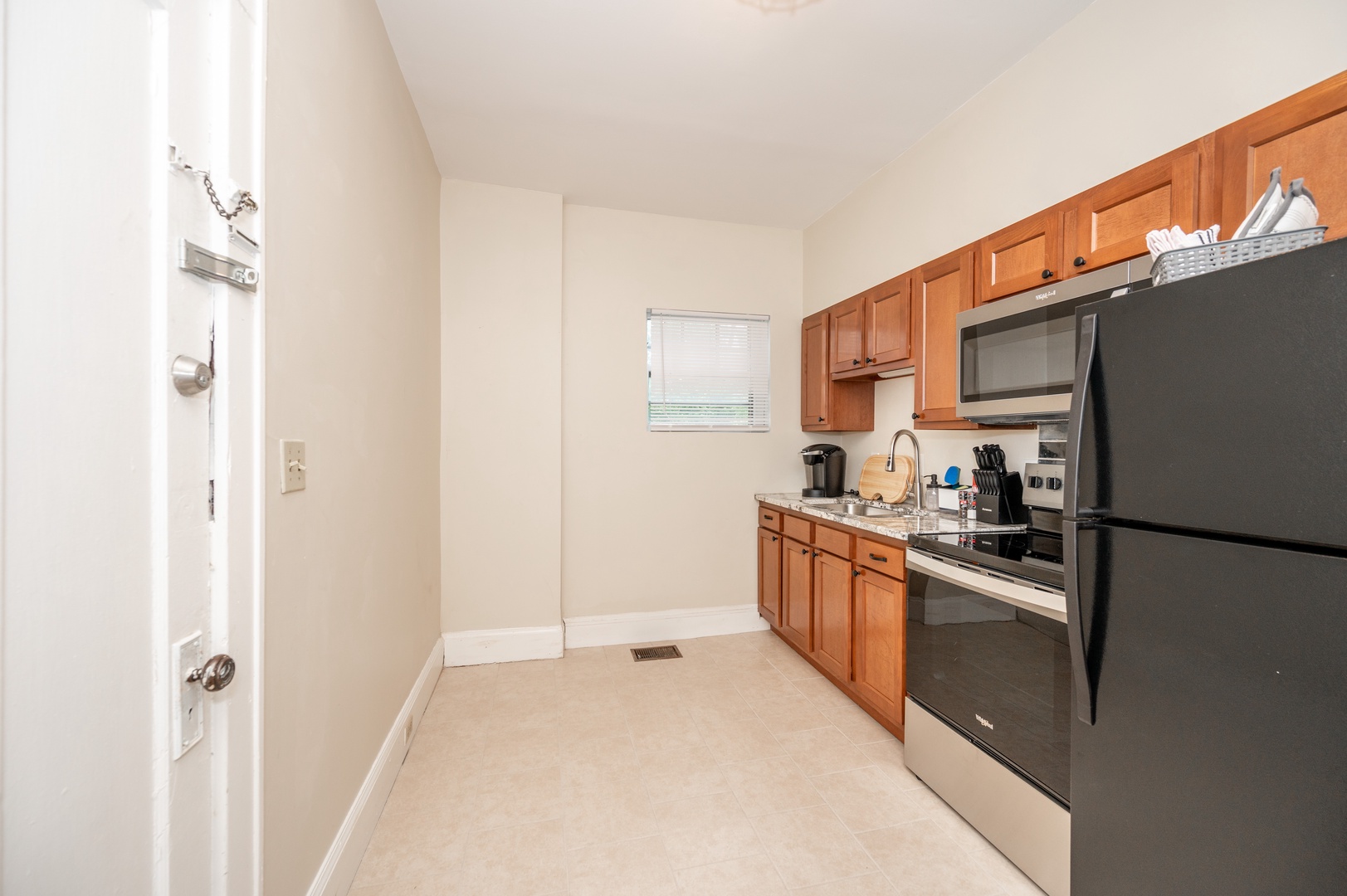 The open, airy kitchen offers ample space & all the comforts of home