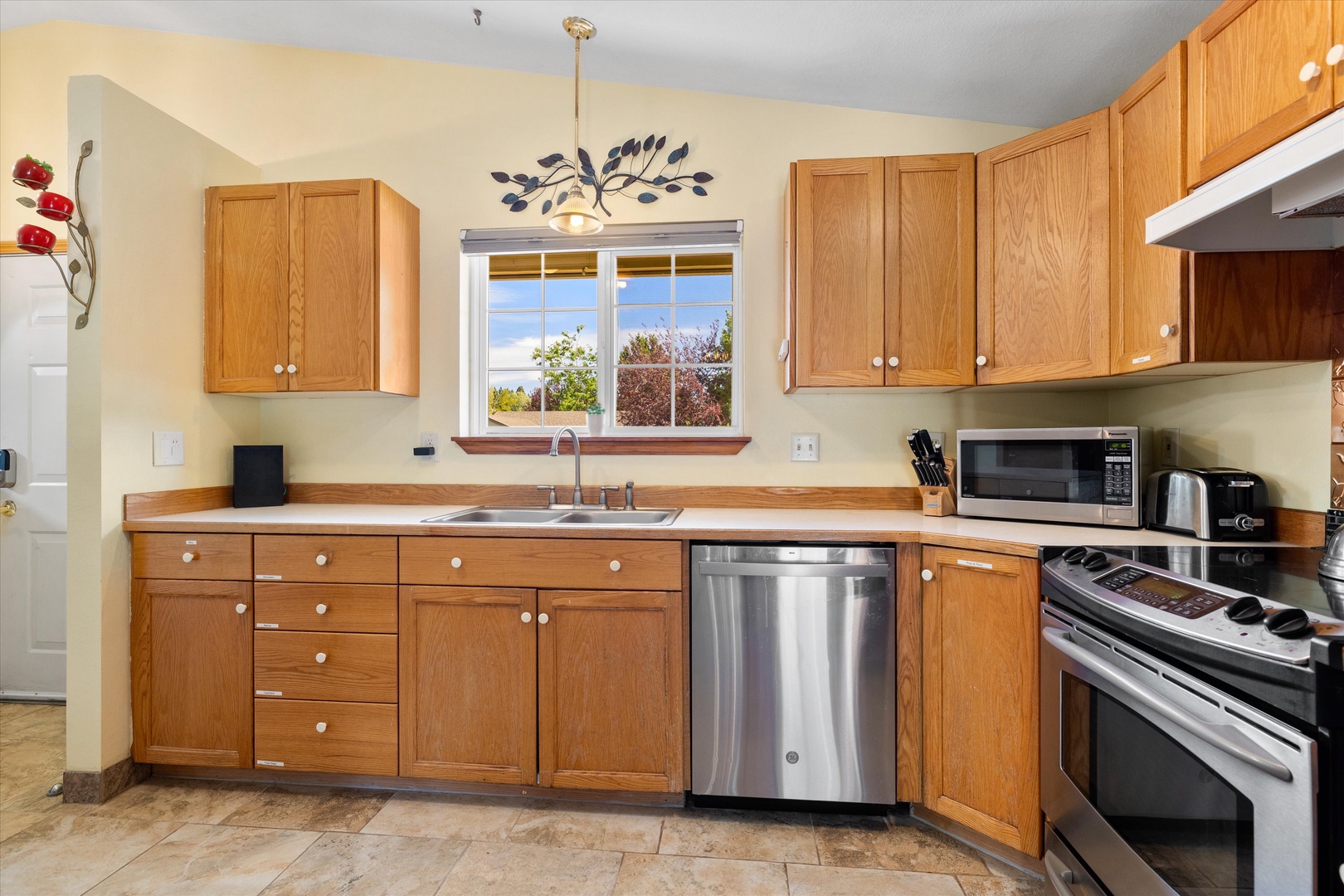 The open, breezy kitchen offers ample space & all the comforts of home