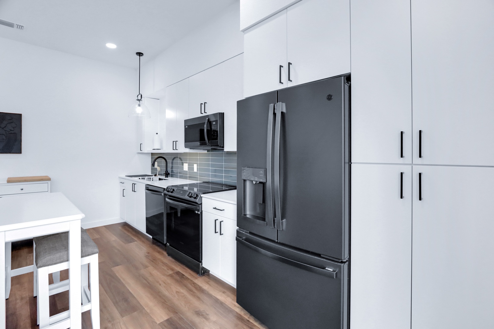 Modern kitchen with sleek appliances and plenty of storage