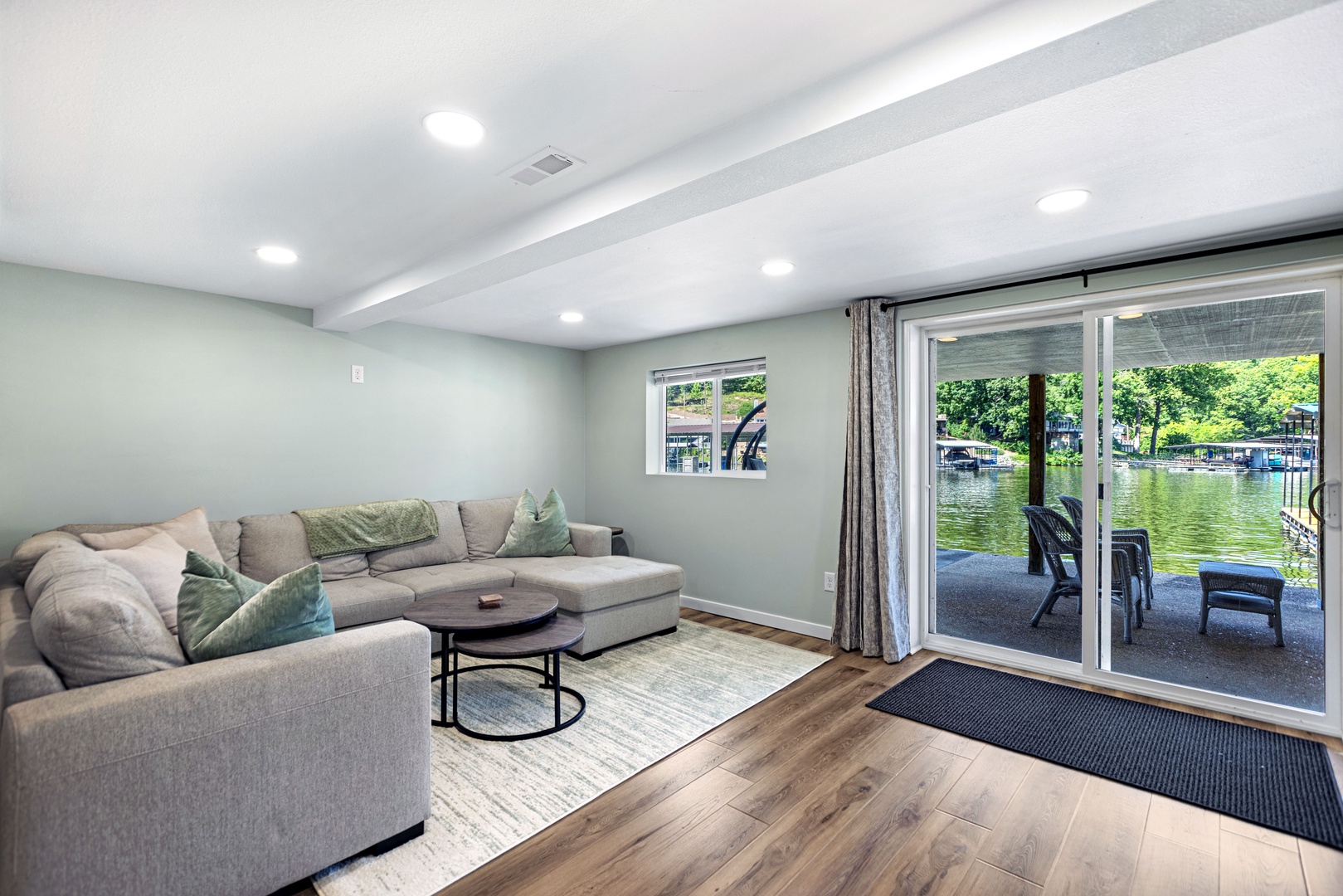 Basement space with sectional seating and Smart TV