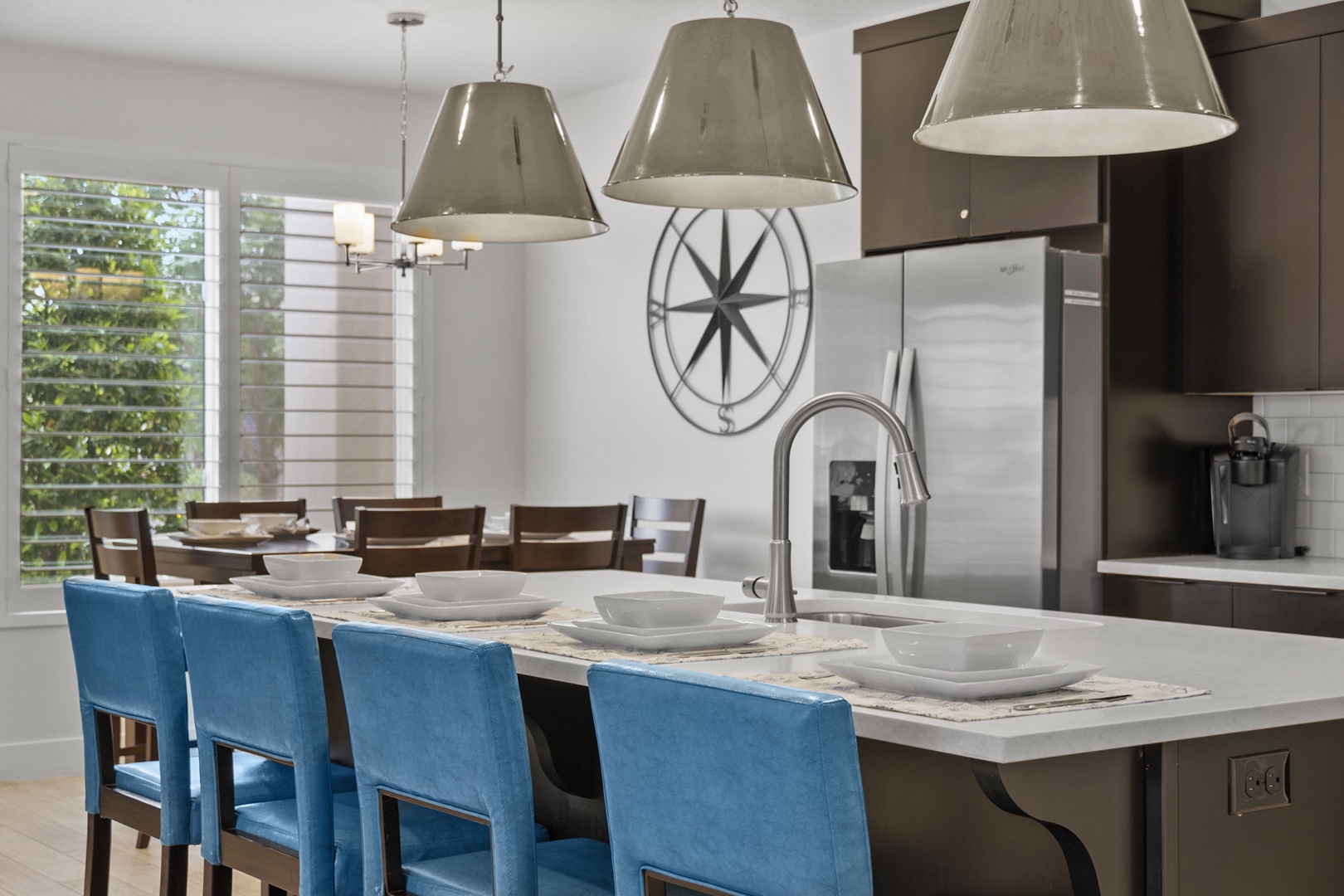 Enjoy comfortable dining seating for 6 and counter seating for 4 in the sleek Kitchen/Dining spaces