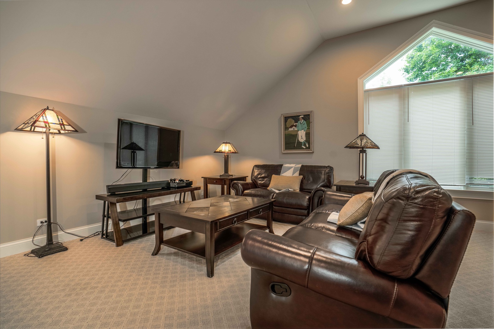 Game room with sitting area, Smart TV, wet bar, pool table, and poker table