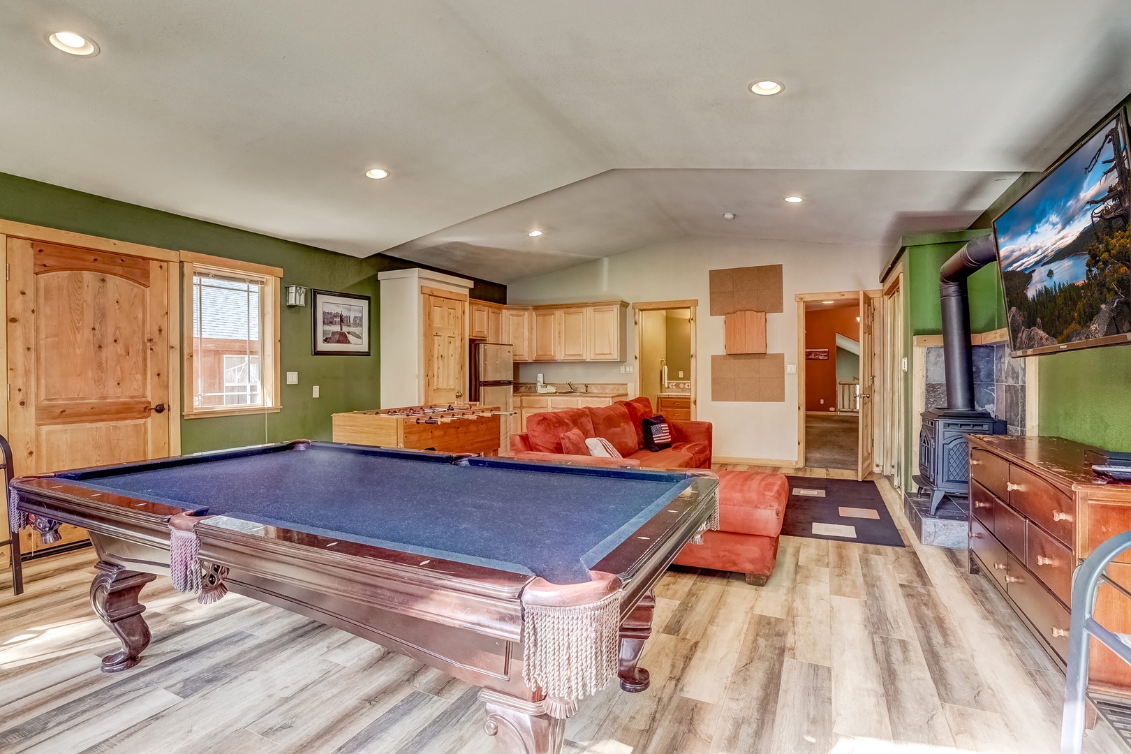 Game room with pool table, foosball table, dart board, cable TV