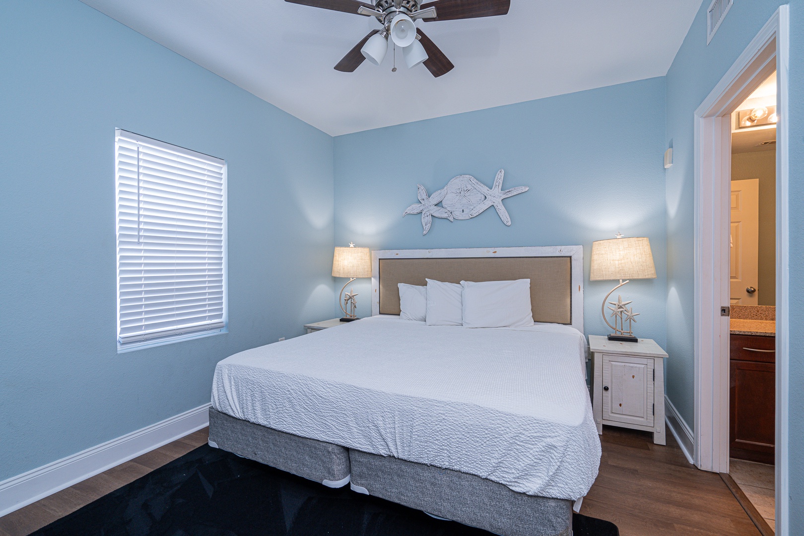 The coastal chic suite boasts a plush king bed, private ensuite, & TV