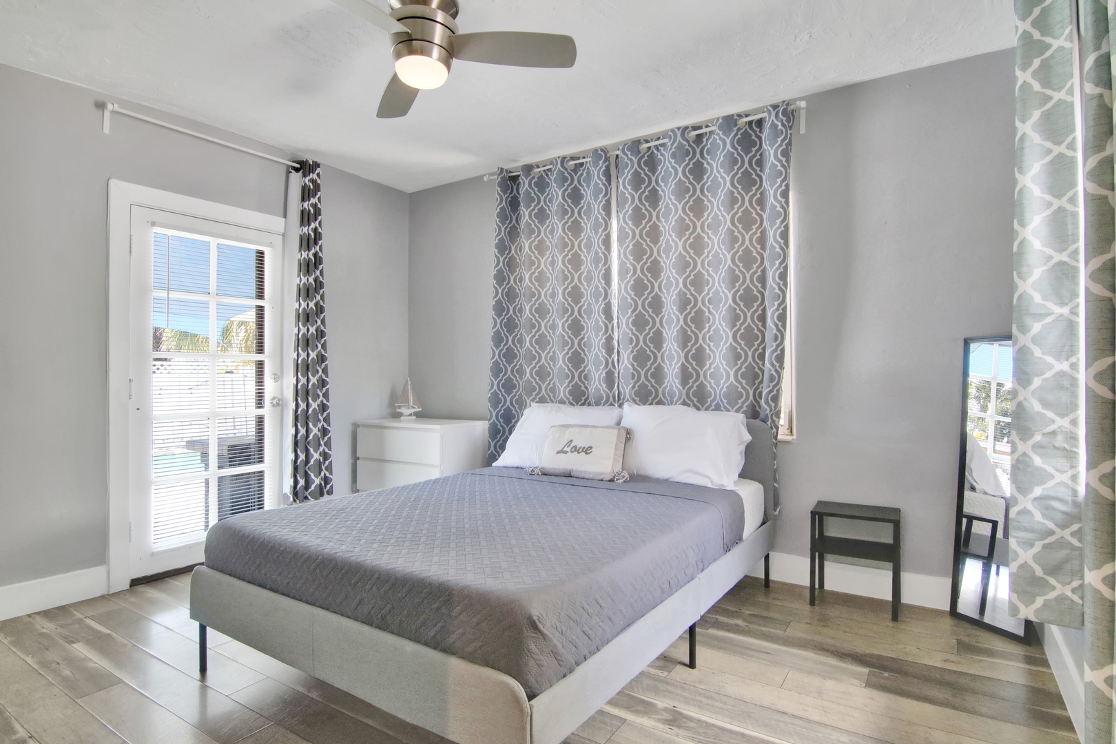 Unit 2: This cozy queen bedroom offers a Smart TV & access to the pool area