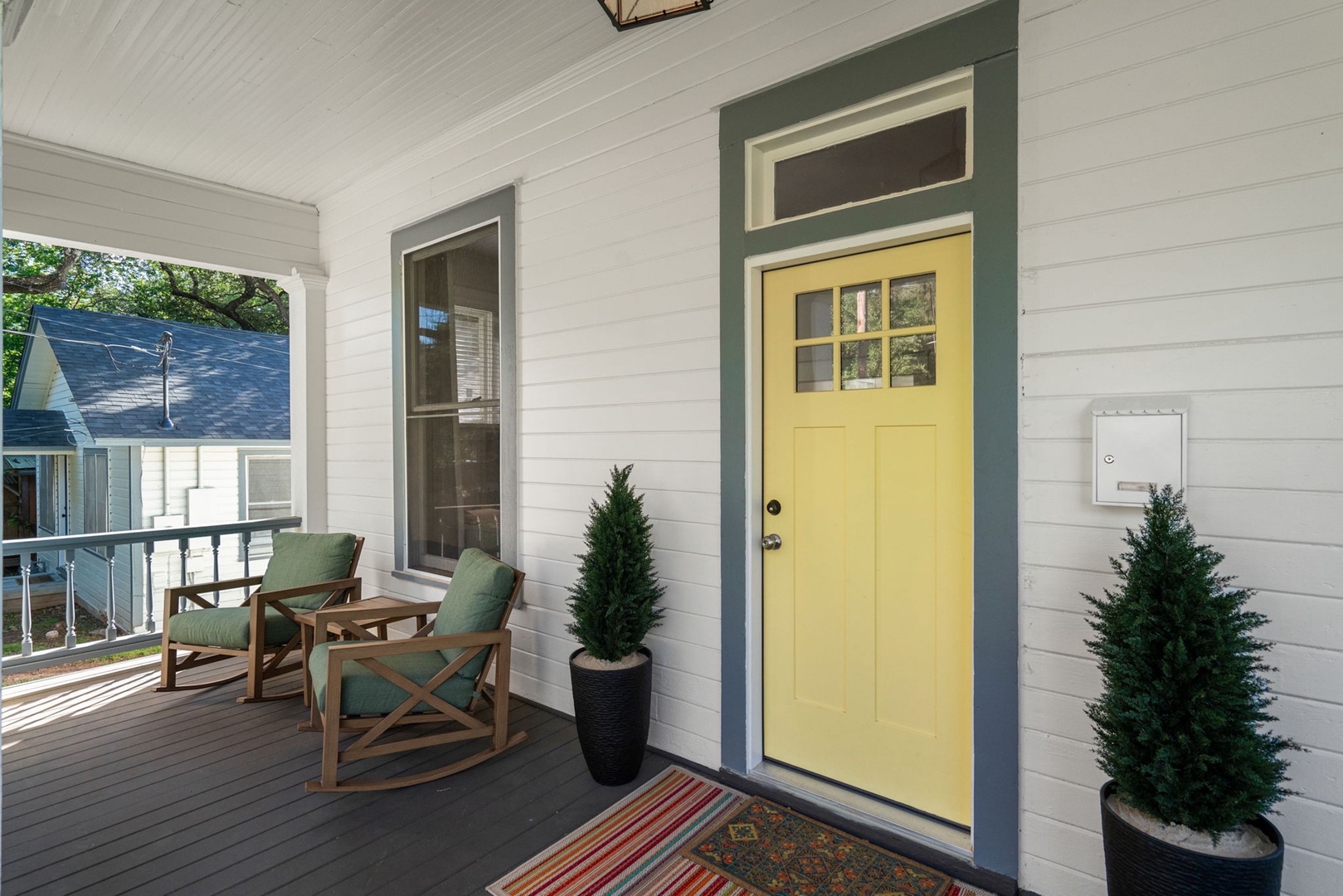 Relax & watch the world go by from the tranquil front porch
