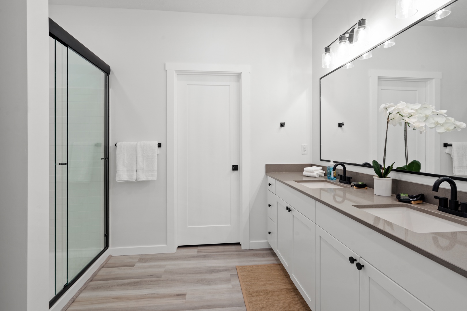 Enjoy a double vanity & glass shower in this main-floor ensuite