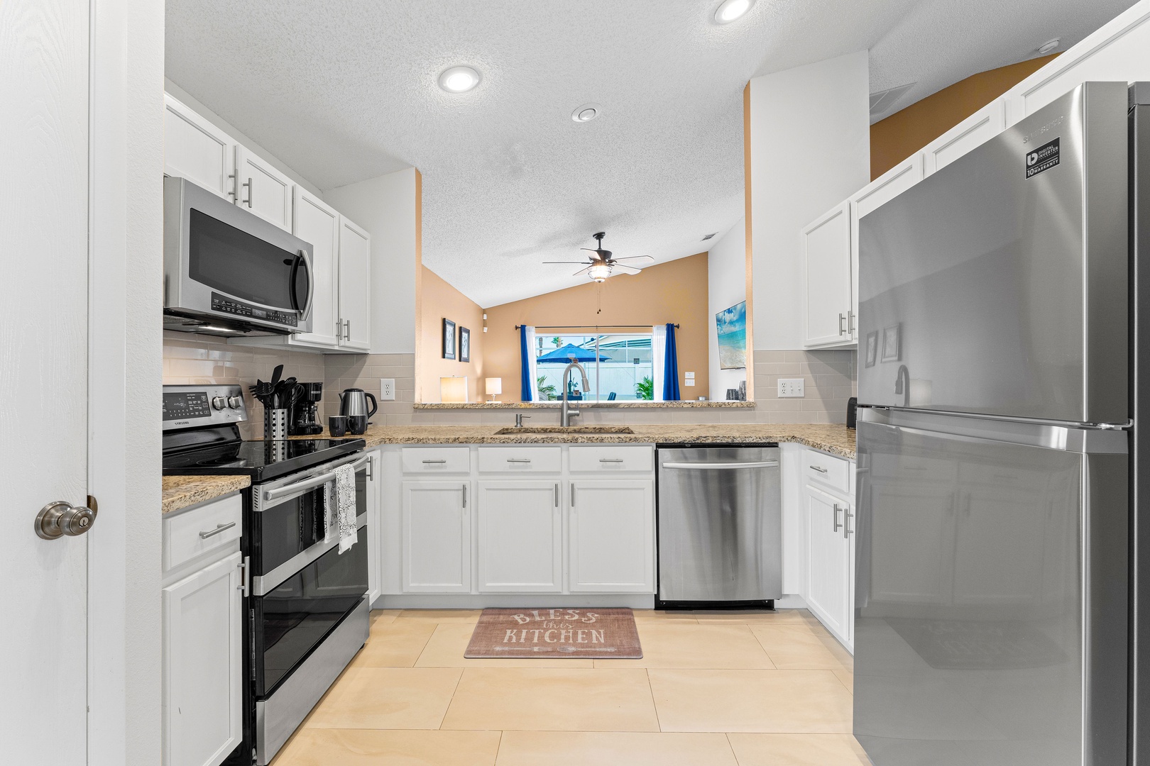 The open, airy kitchen offers ample space & all the comforts of home