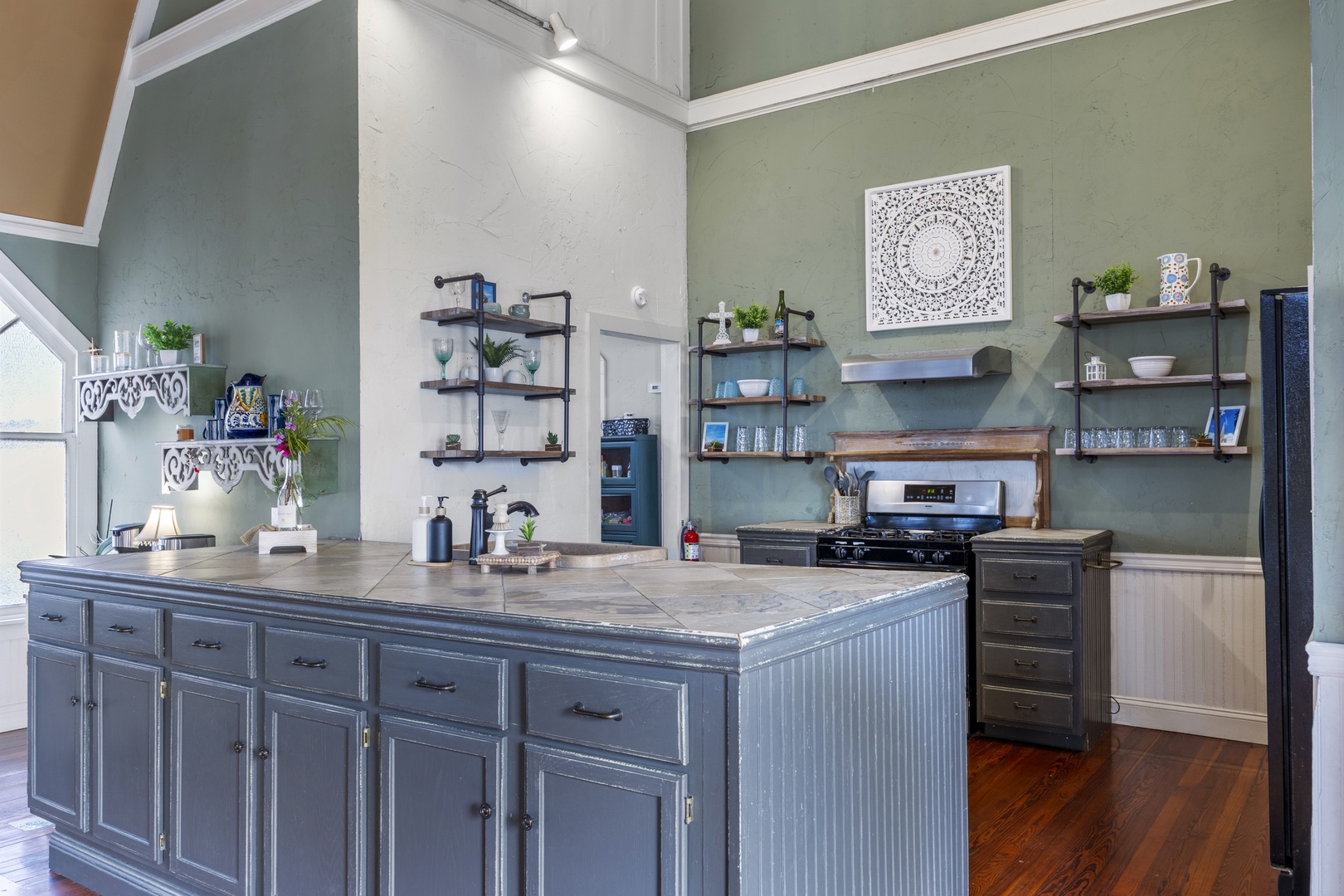 The open, airy kitchen offers ample space & every home comfort