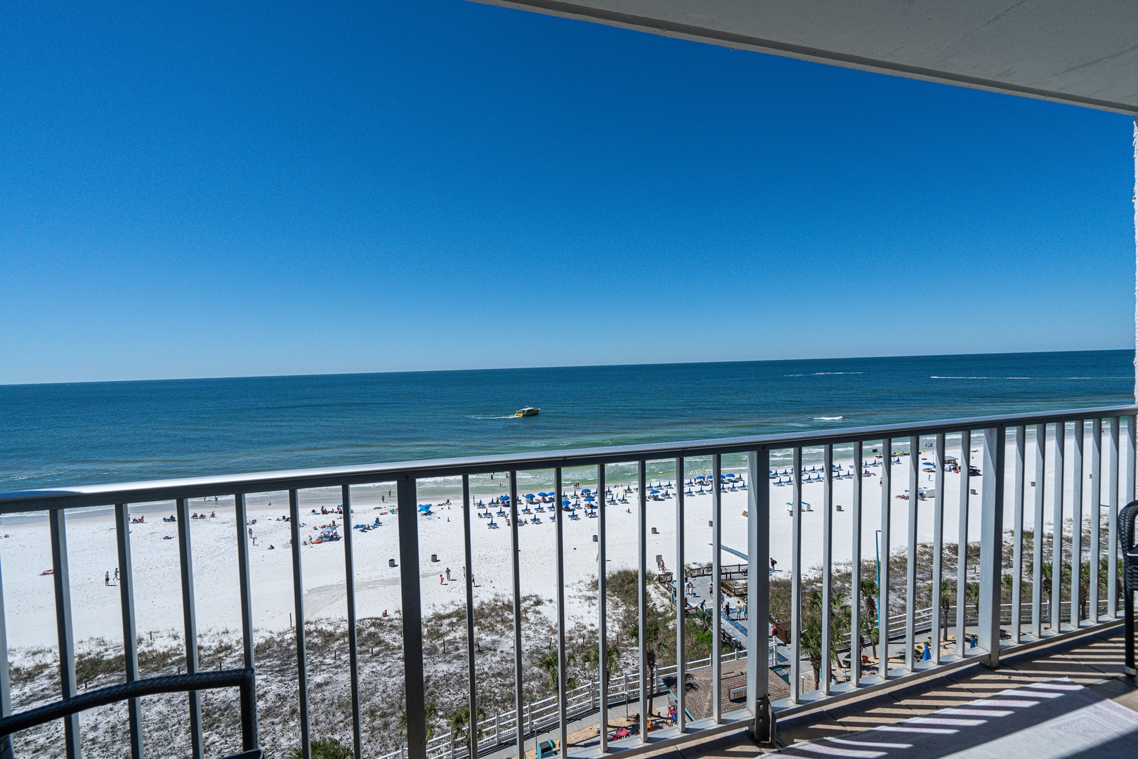 Retreat to the deck and enjoy vistas of the beach
