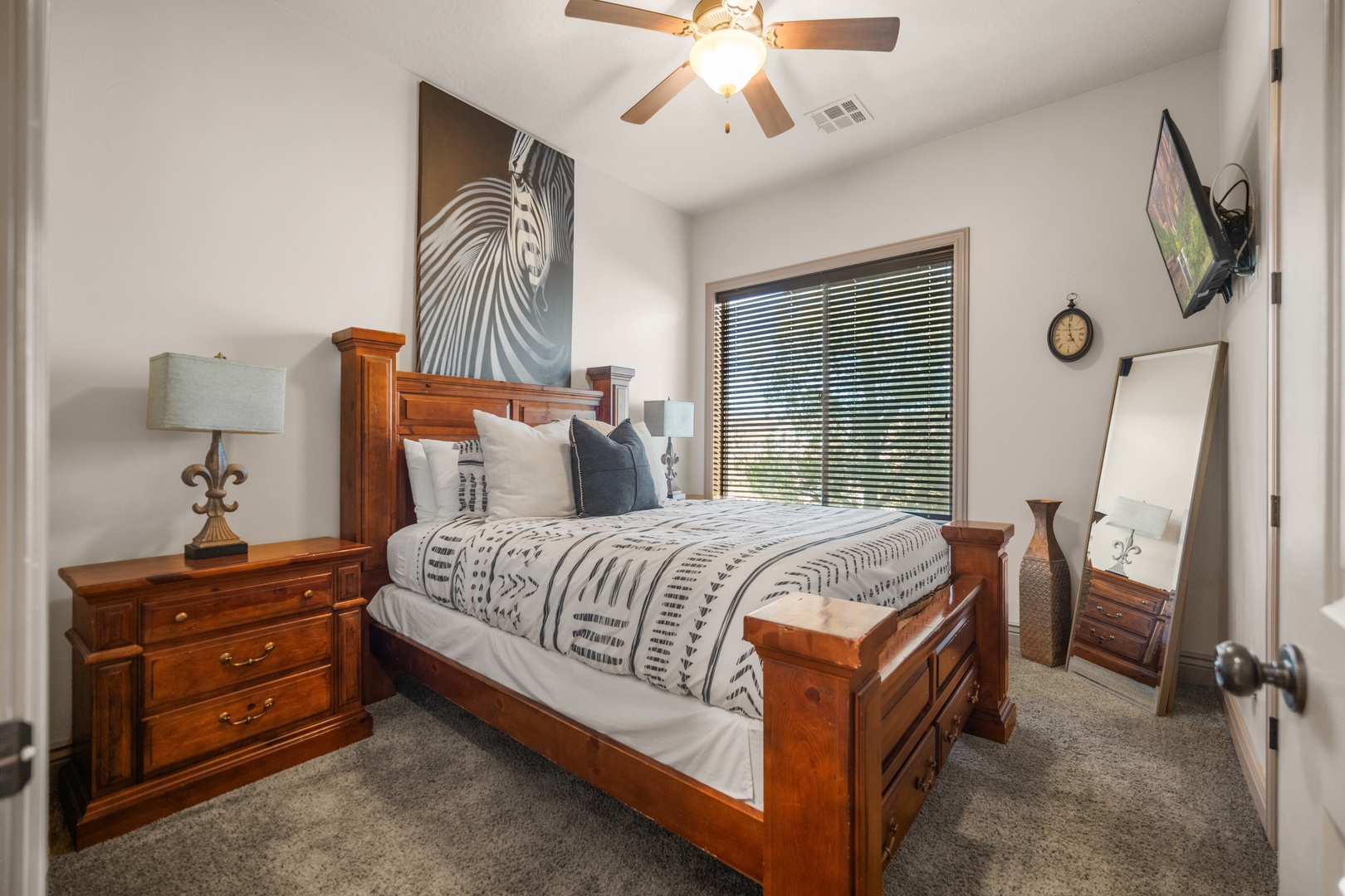 Recharge in the second bedroom, boasting a queen bed & smart TV