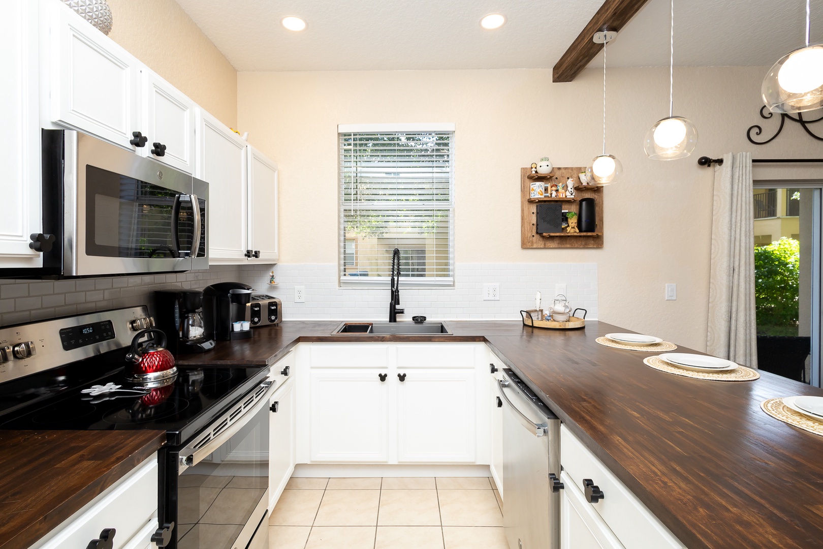 The open, airy kitchen offers ample space & all the comforts of home