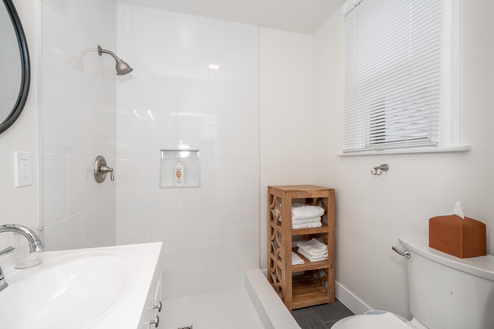 Apartment A’s full bath includes a single vanity & shower