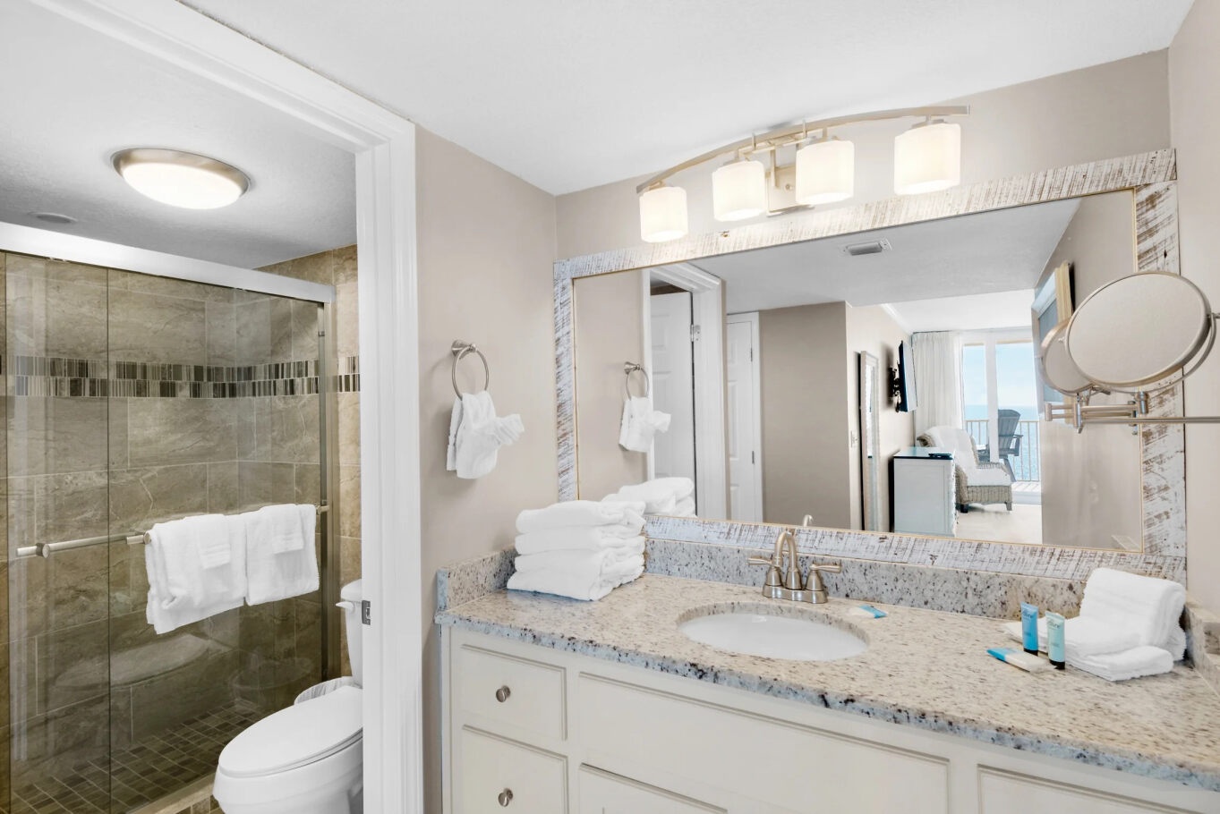 The primary king en suite offers a spacious single vanity & glass shower