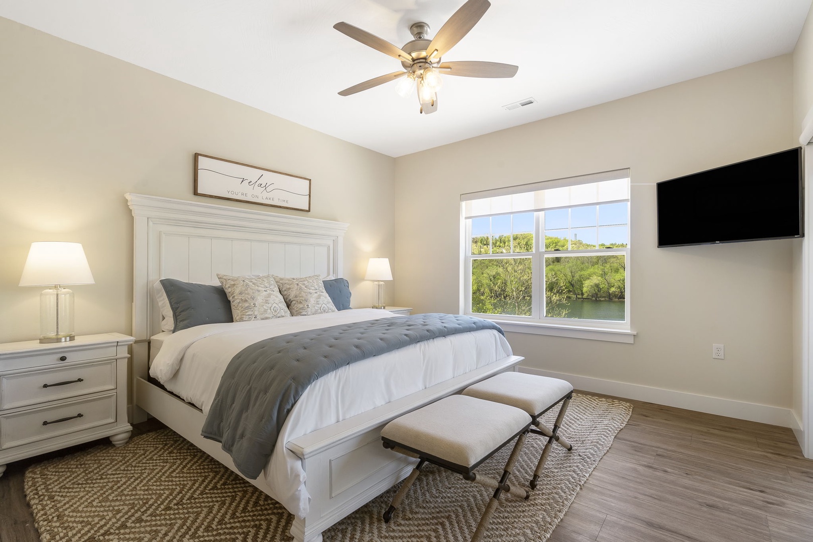 The Master Bedroom offers a King Bed, TV, En Suite Bathroom, and stunning lake views