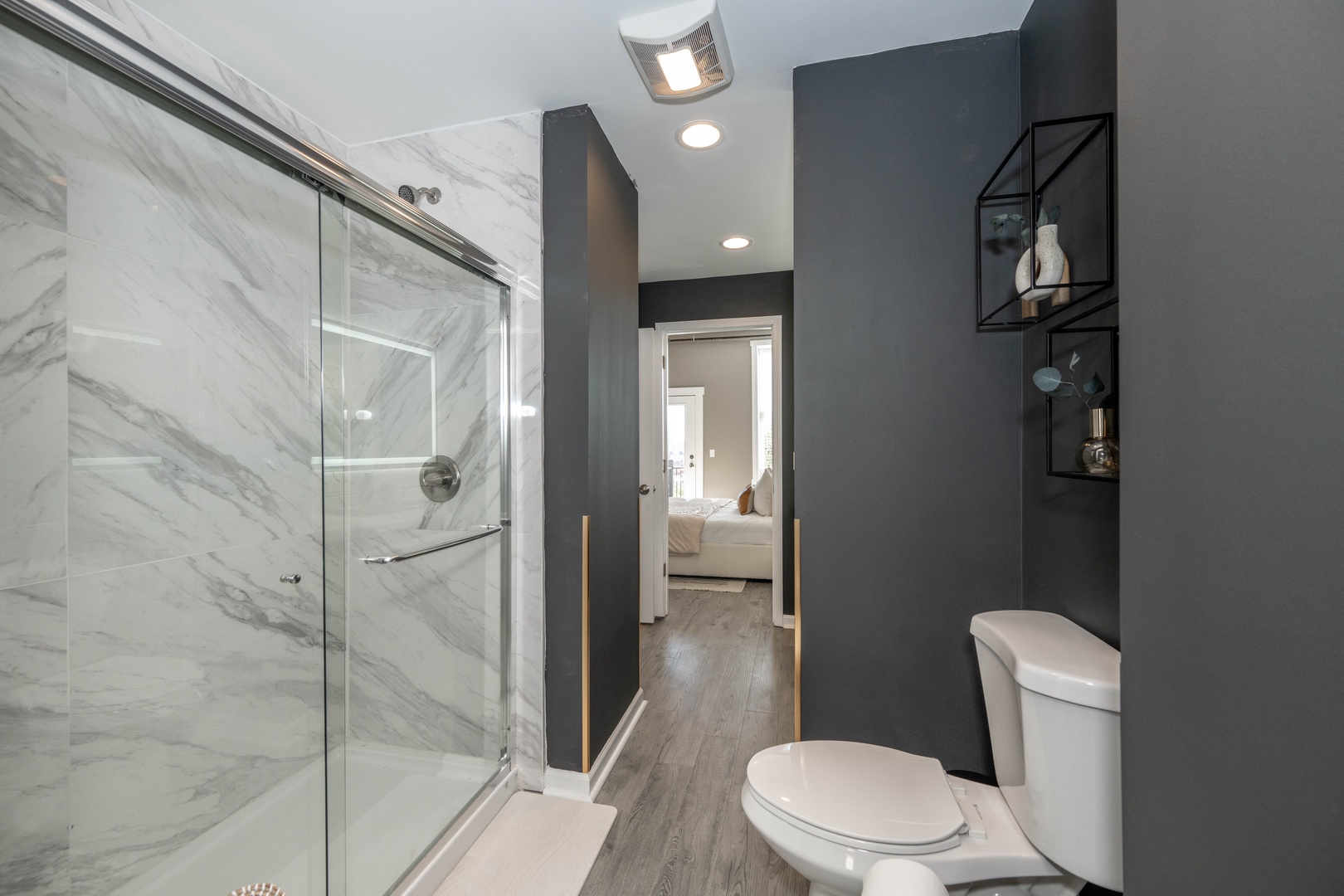 Wash up in the ensuite bath, featuring a double vanity & glass shower