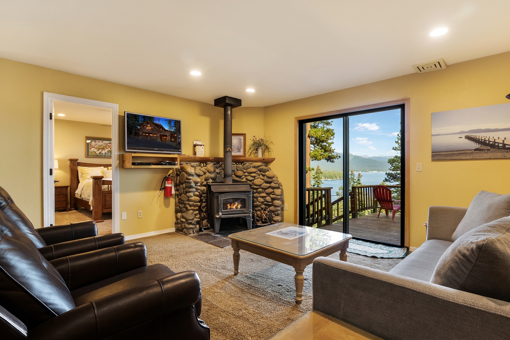 Lower living area with sofa sleeper, Smart TV, and deck