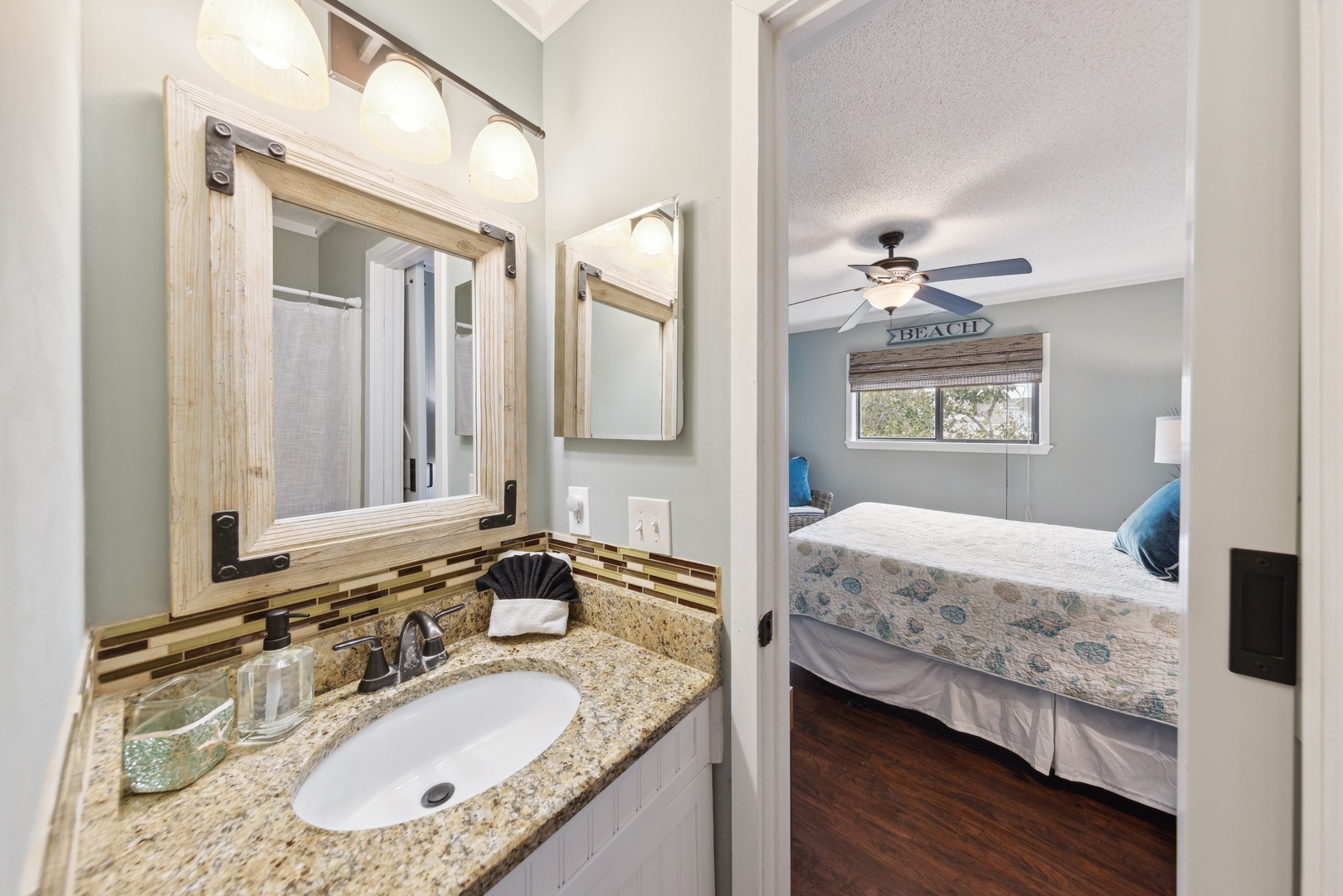 The queen ensuite bathroom includes a single vanity & shower/tub combo