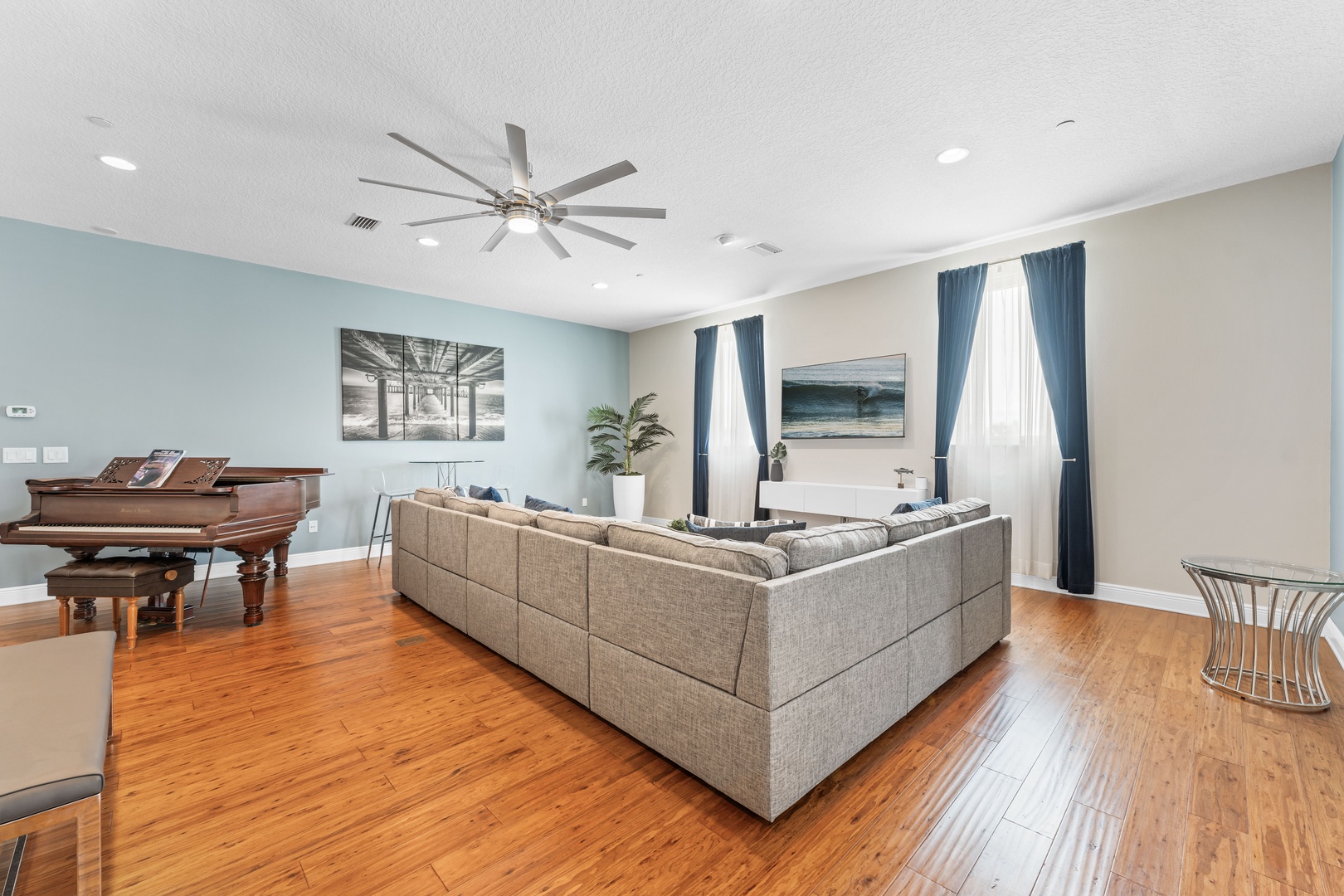 Living area with large sectional and Smart TV