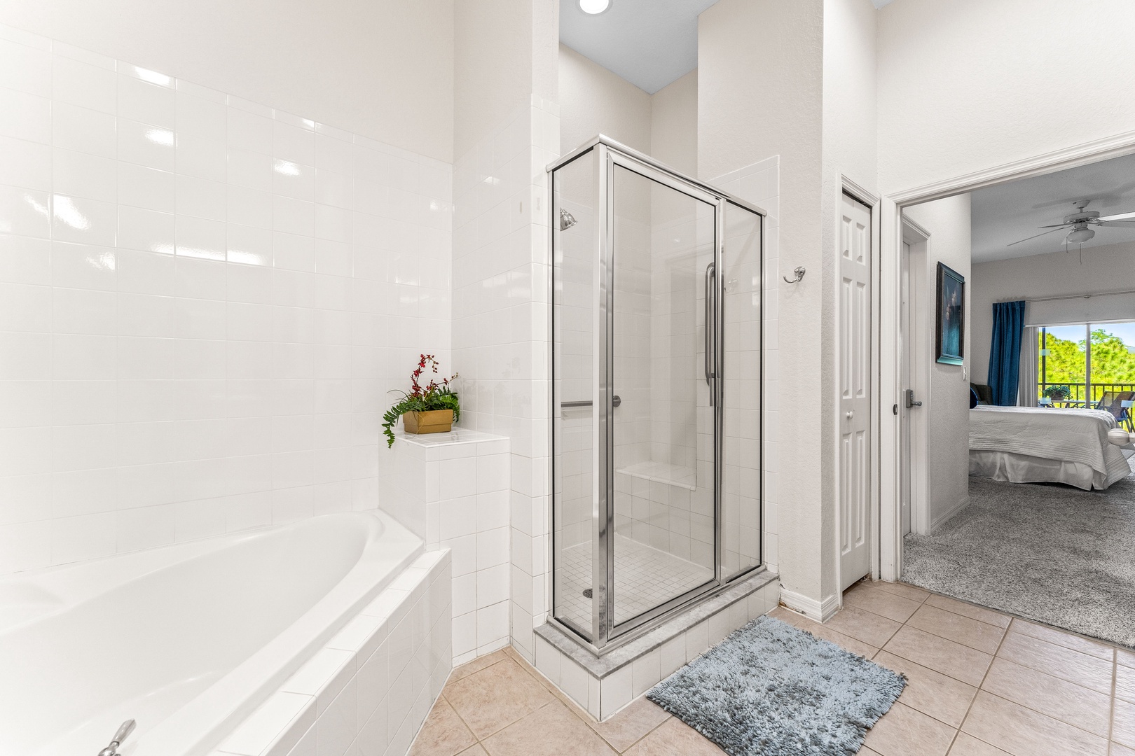 Spacious master ensuite with double vanity, separate soaking tub, and walk-in shower