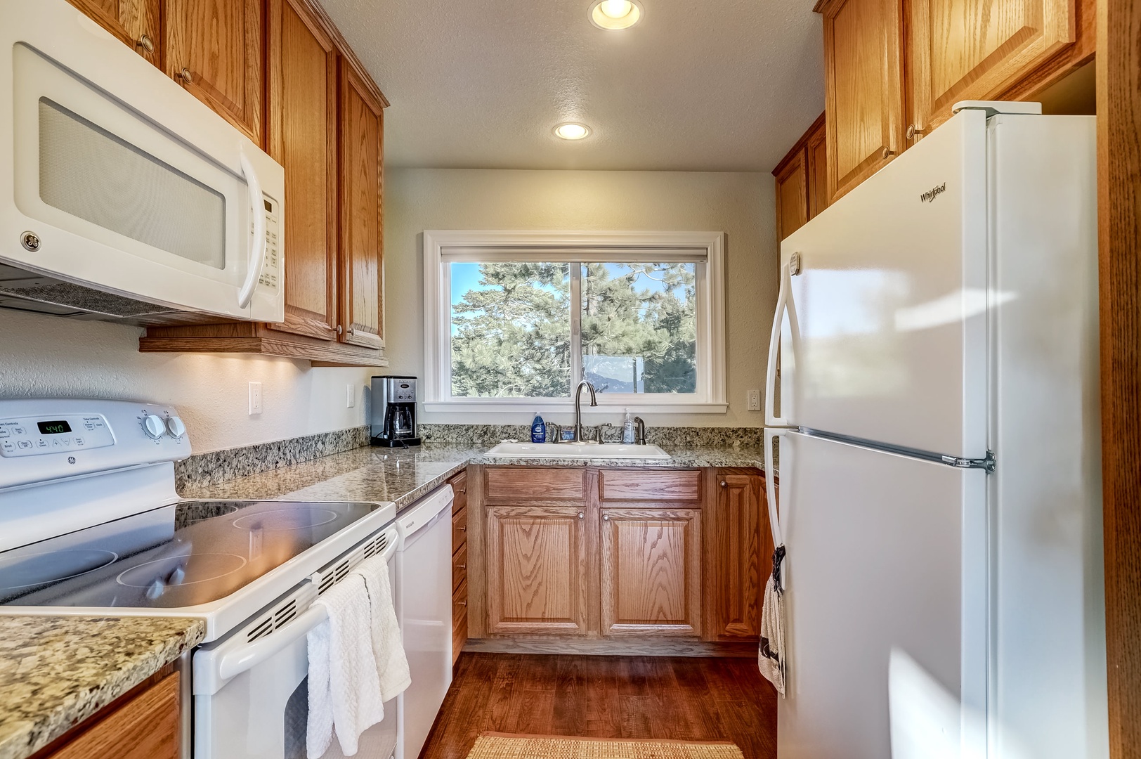 Full kitchen with wine fridge, dishwasher, and standard drip coffee maker