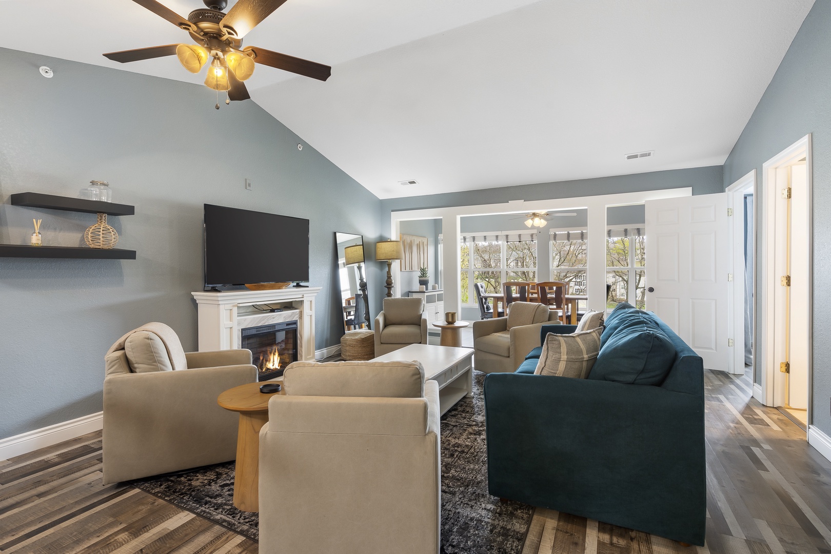 Curl up in the airy living room & enjoy a movie night by the electric fireplace