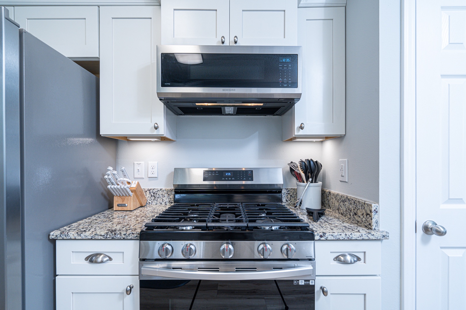 The breezy kitchen offers ample space & all the comforts of home