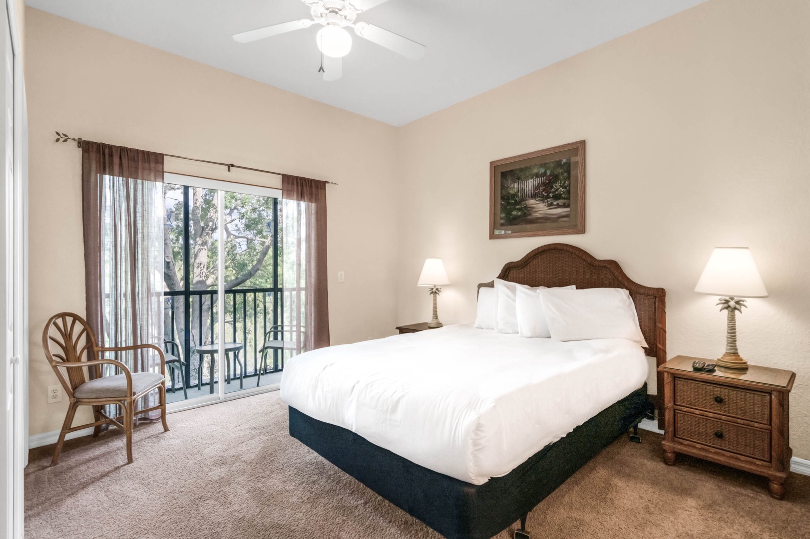 The luxurious queen master Suite offers ample space, en suite, balcony access, and TV