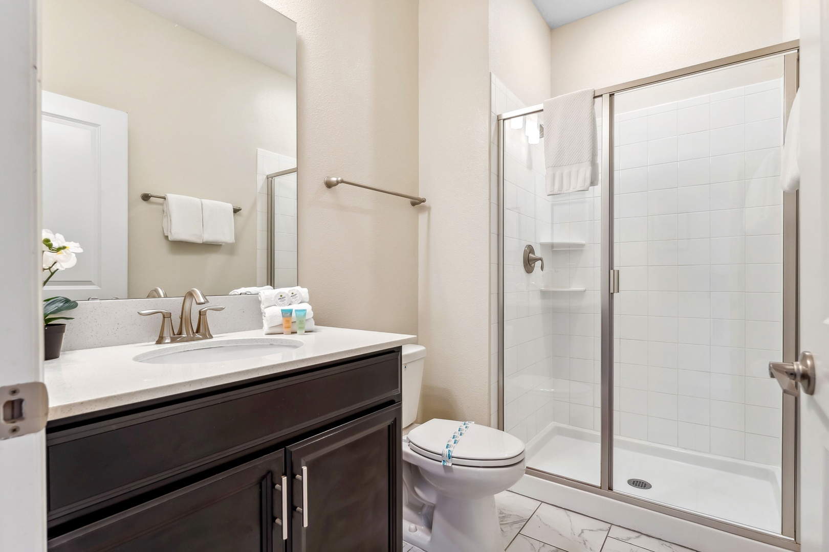 Stylish shared bathroom with a spacious shower and modern amenities