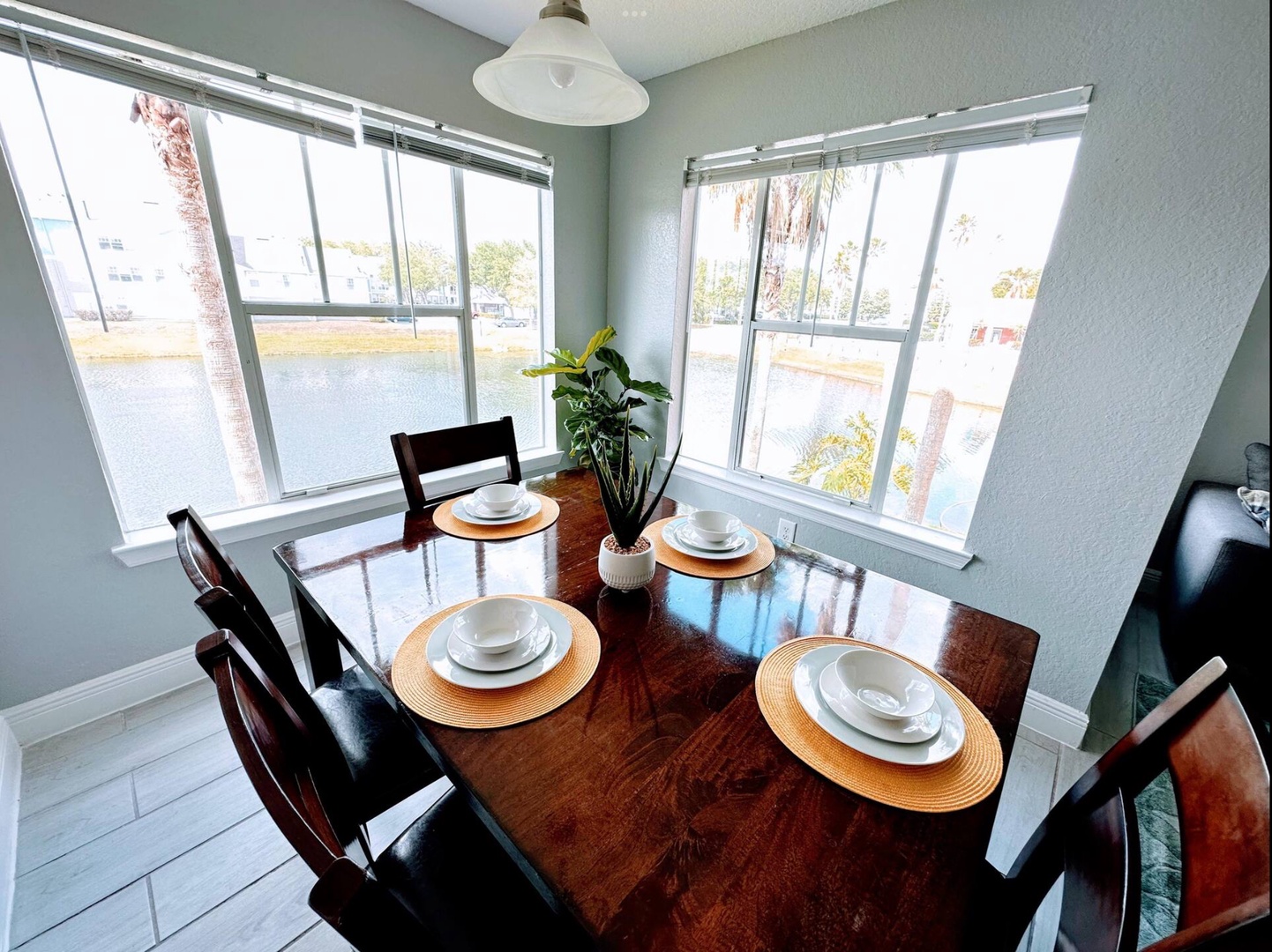 Gather for meals at the dining table with a waterfront view, seating for 6