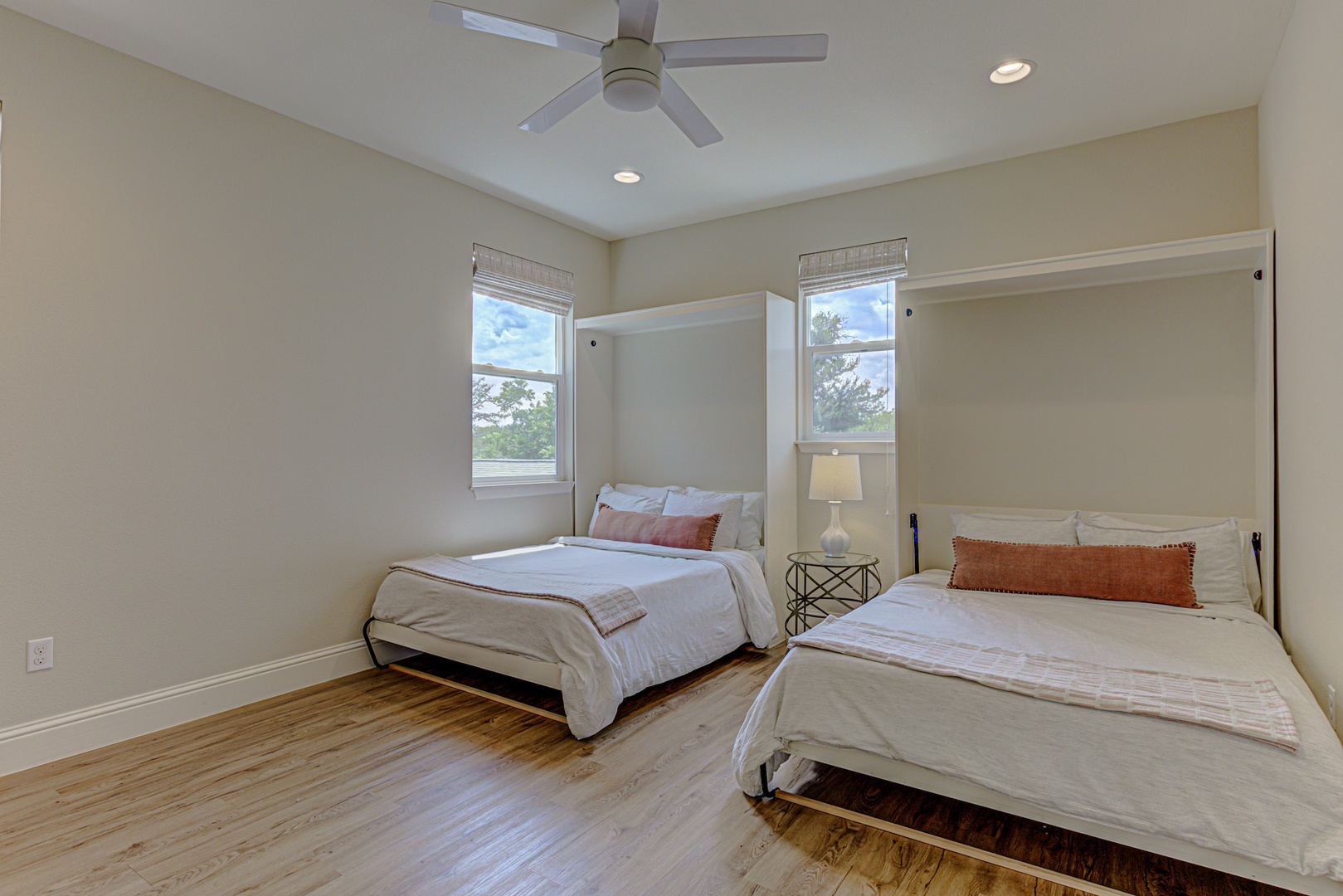 The final bedroom off the loft showcases a pair of plush full Murphy beds