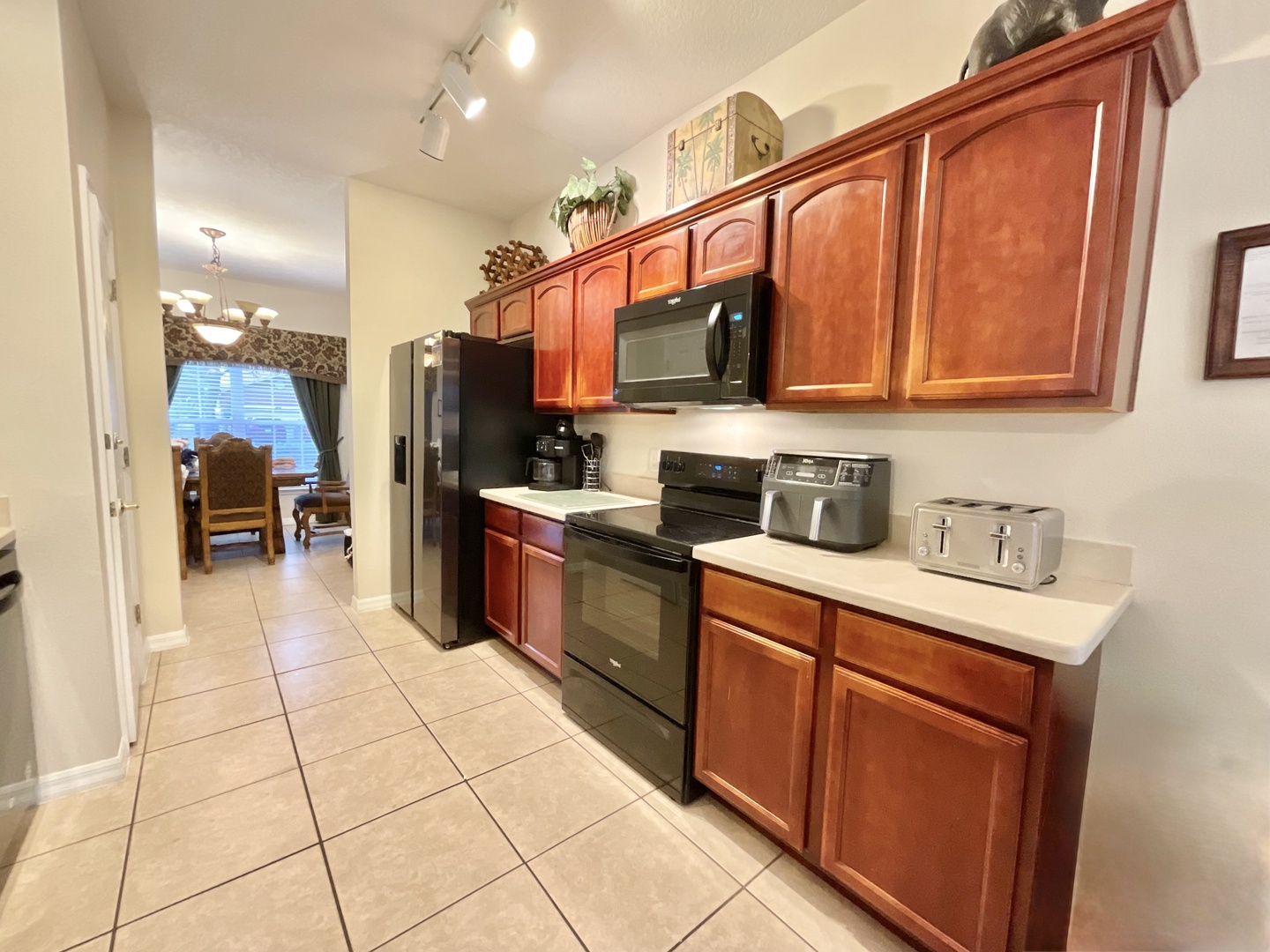 The kitchen offers ample storage space & all the comforts of home