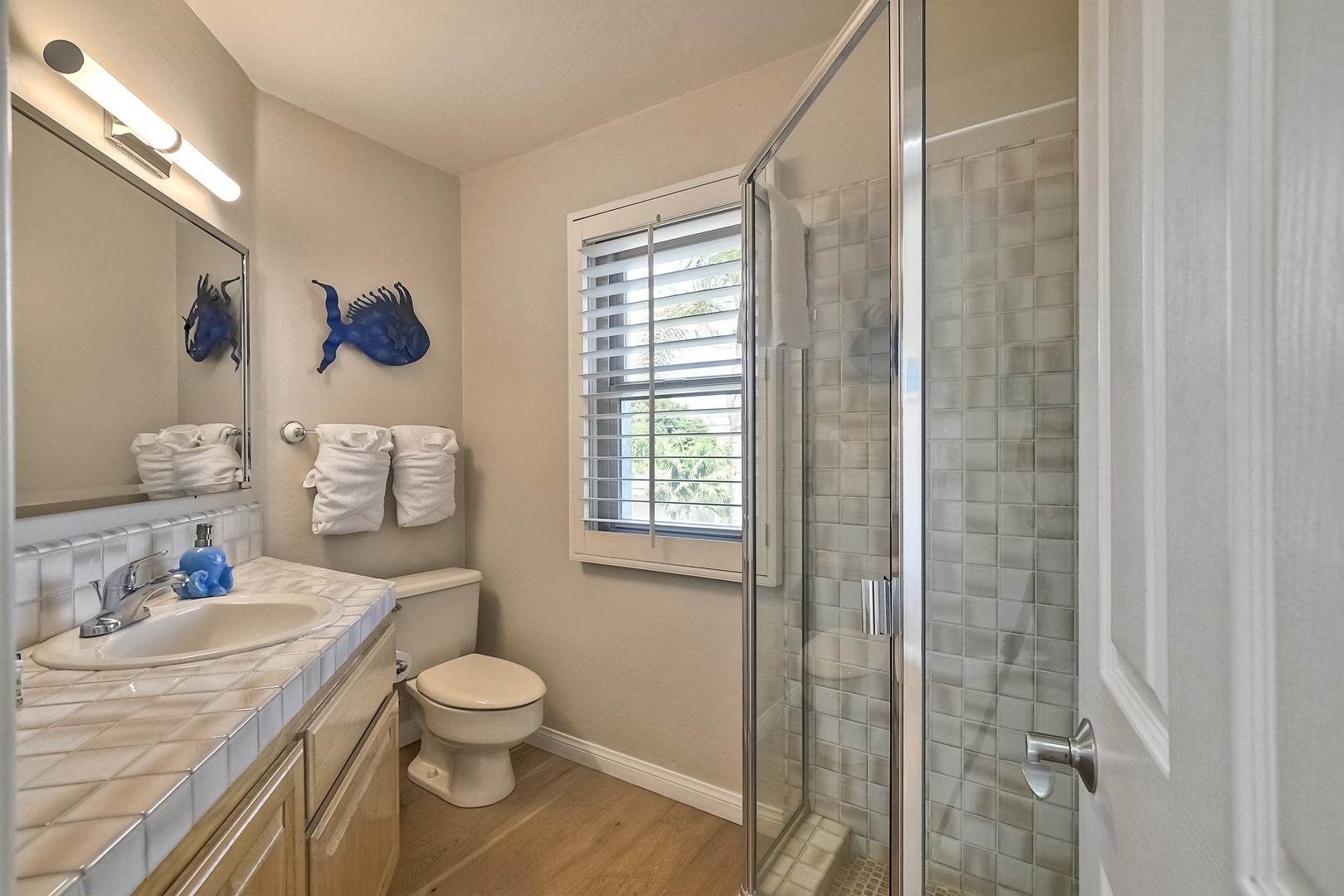 The 2nd floor’s shared full bath offers a large single vanity & walk-in shower