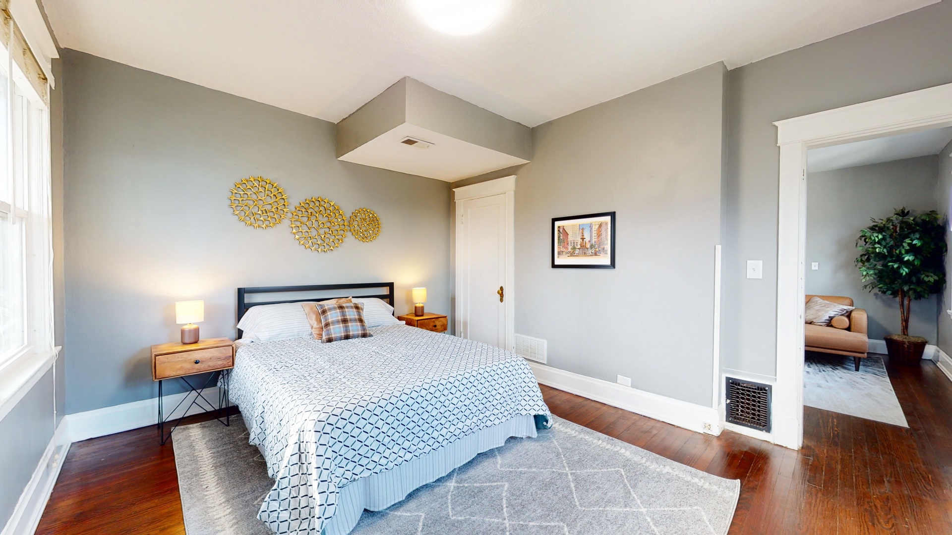 Cityscape tranquility awaits in the master bedroom, with a chic queen bed & private balcony