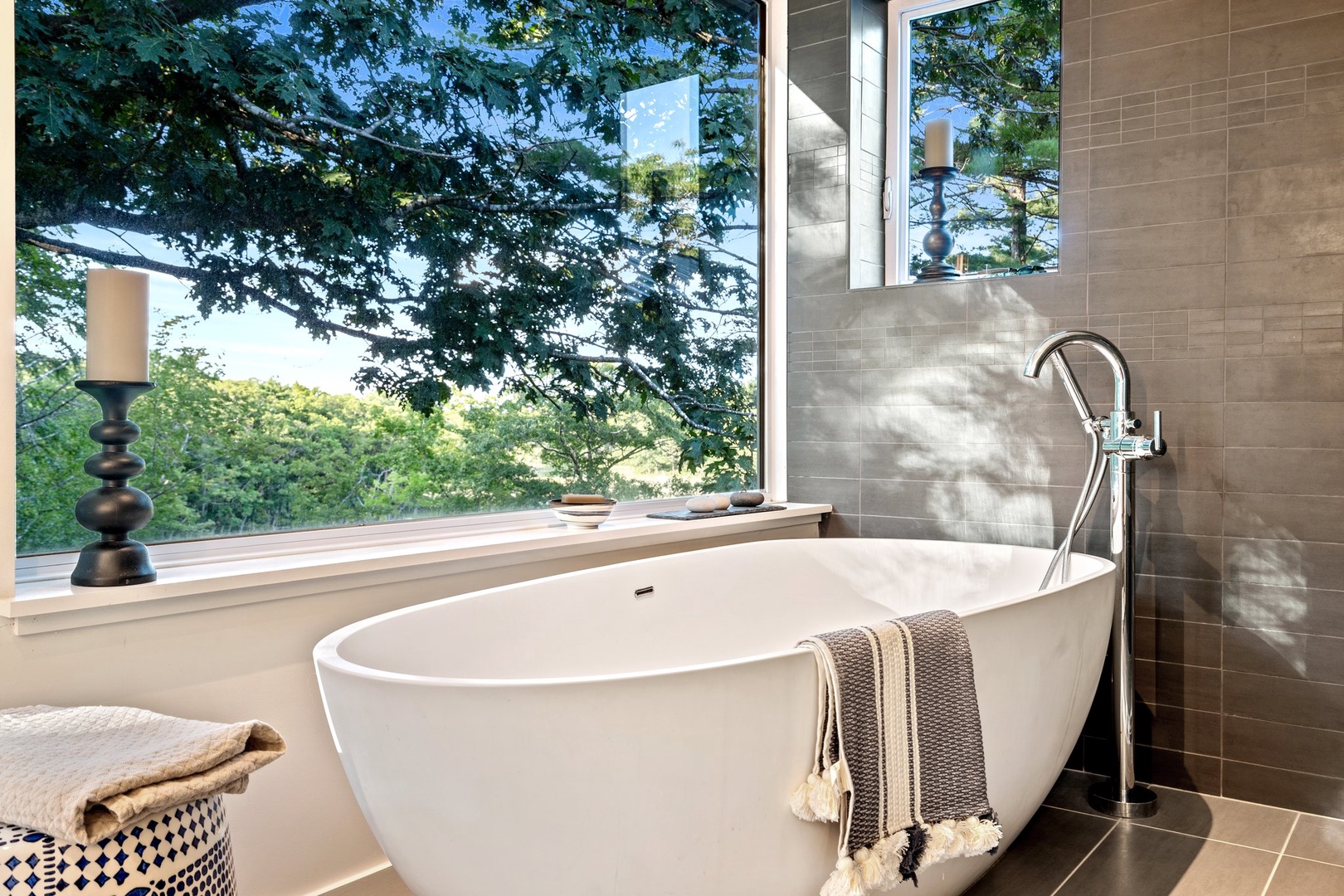 Soak your cares away with serene views in this ensuite's soaking tub