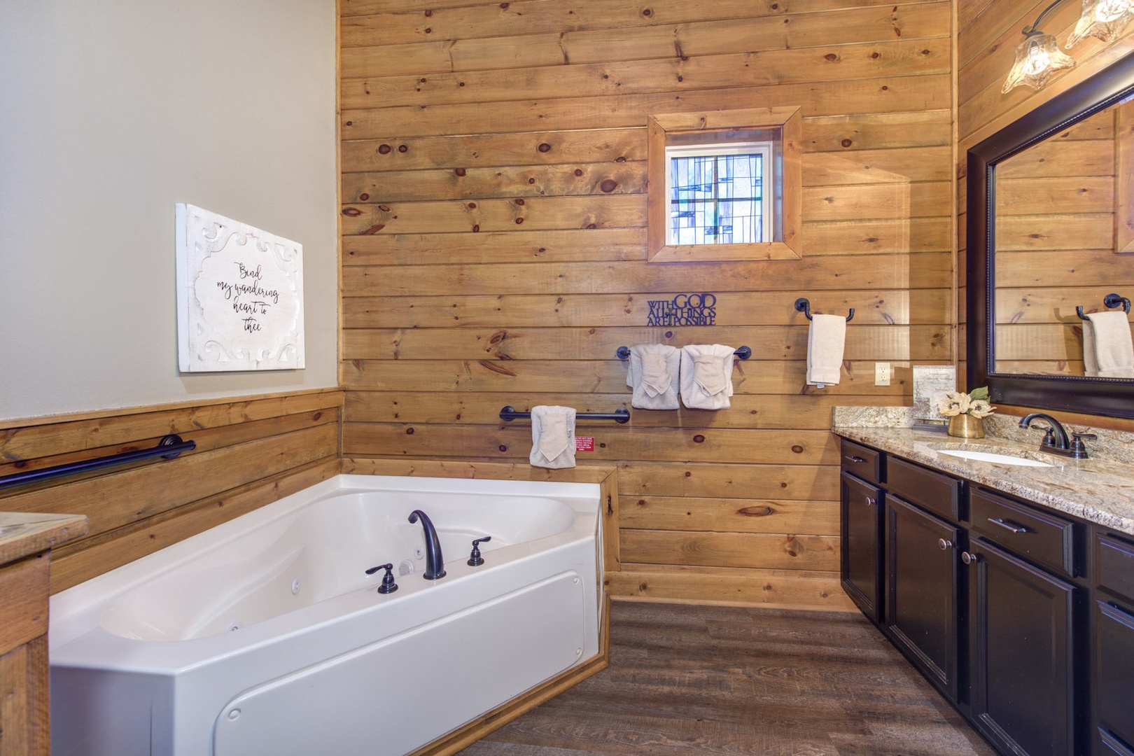 This private ensuite offers an oversized vanity, shower, & soaking tub