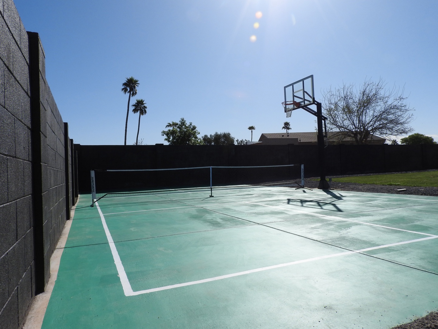 Pool, putting green, and basketball court