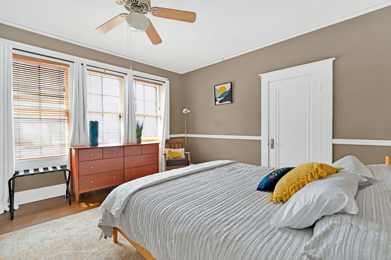 The first of two tranquil bedrooms boasts a plush king-sized bed