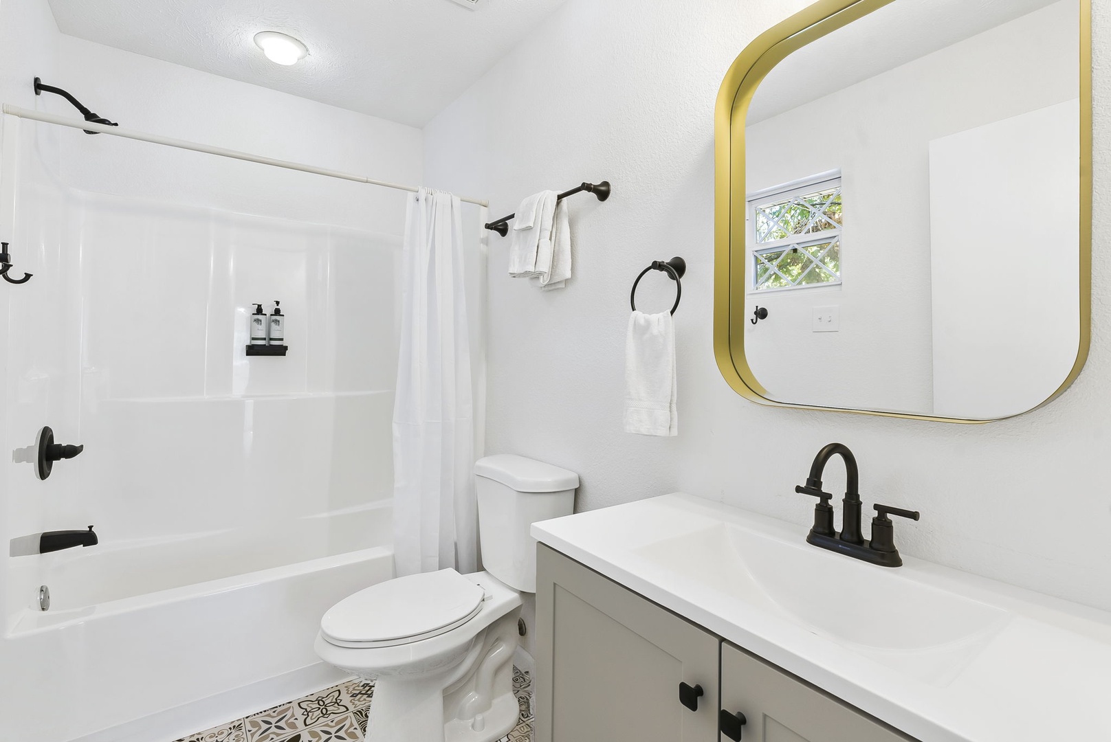 The 2nd floor king en suite offers a single vanity & shower/tub combo