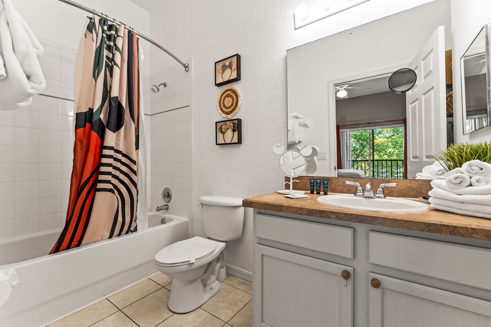 A single vanity & shower/tub combo await in this private ensuite