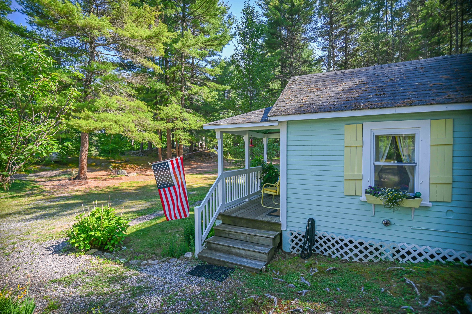 Sip morning coffee or an evening cocktail on the serene front porch